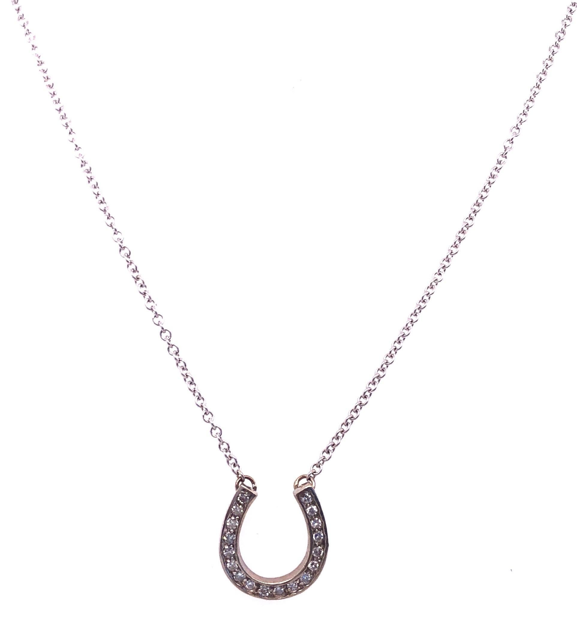14 Karat White Gold 16 inch Necklace with Diamond Horse Shoe Pendant 0.50 Total Diamond Weight.
3.88 grams total weight.
