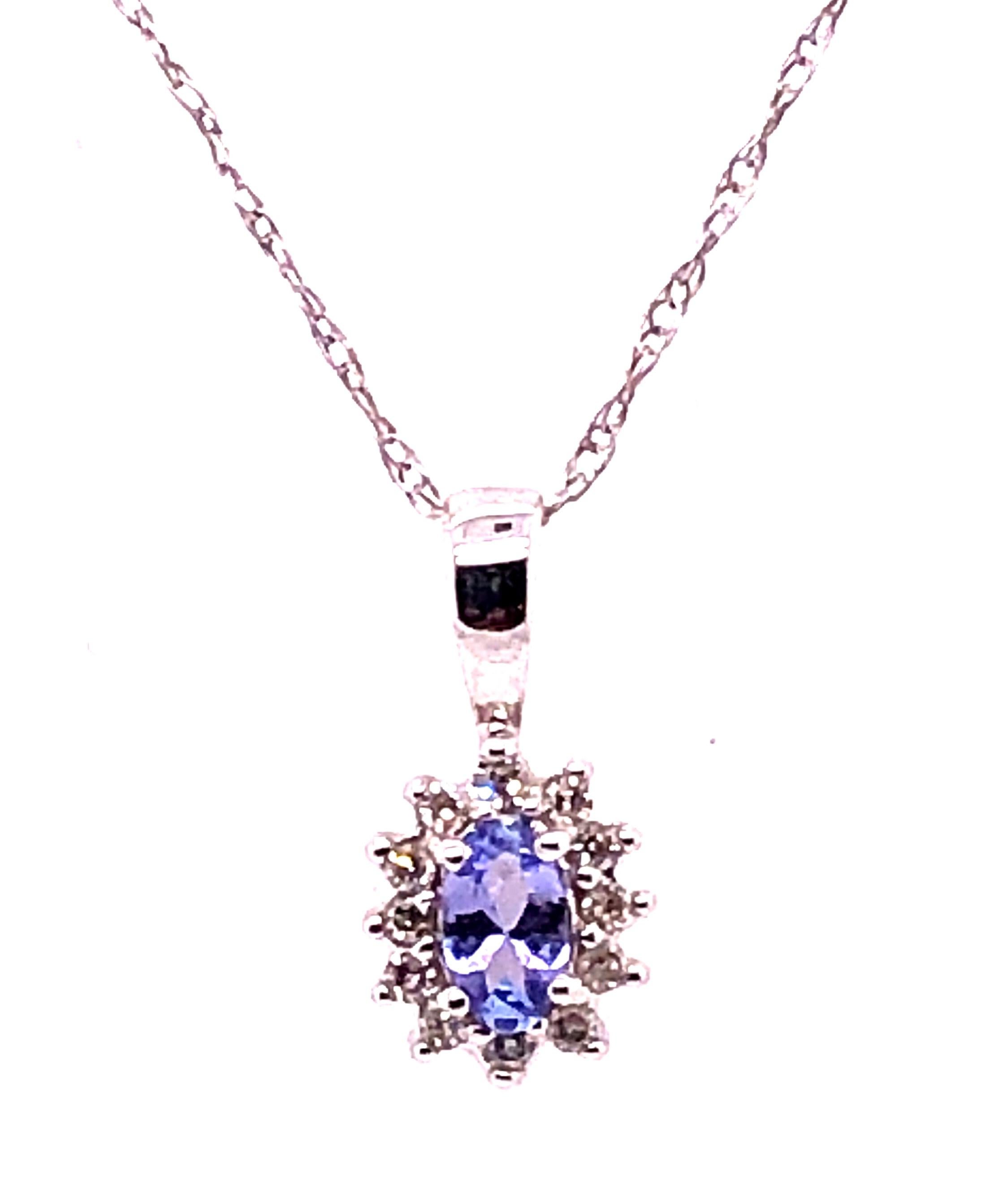 14 Karat White Gold 16 Inch Necklace with Diamonds and Oval Tanzanite Pendant.
2.33 grams total weight.
Pendant and Chain both stamped 14K.