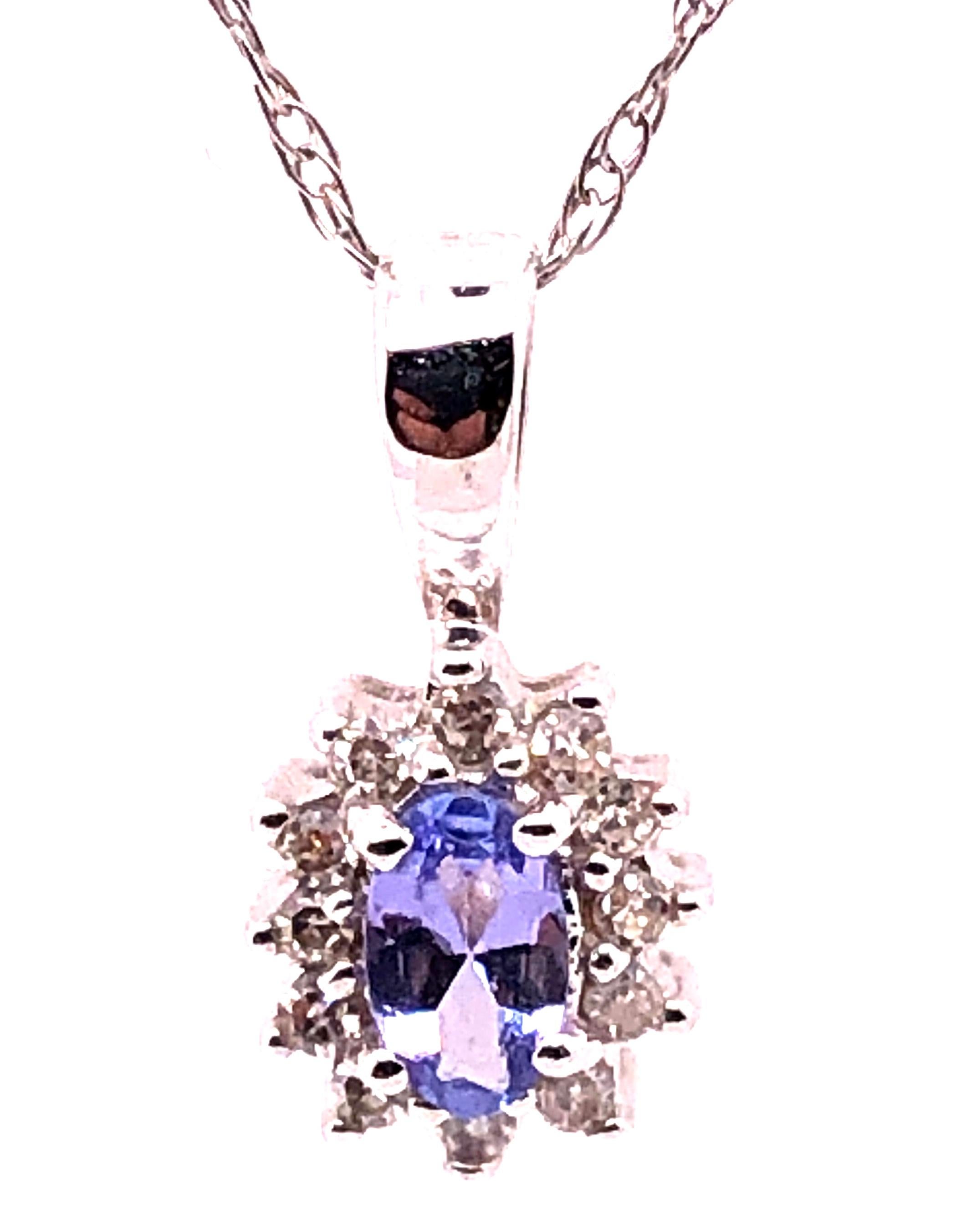Contemporary 14 Karat White Gold Necklace with Diamonds and Oval Tanzanite Pendant For Sale