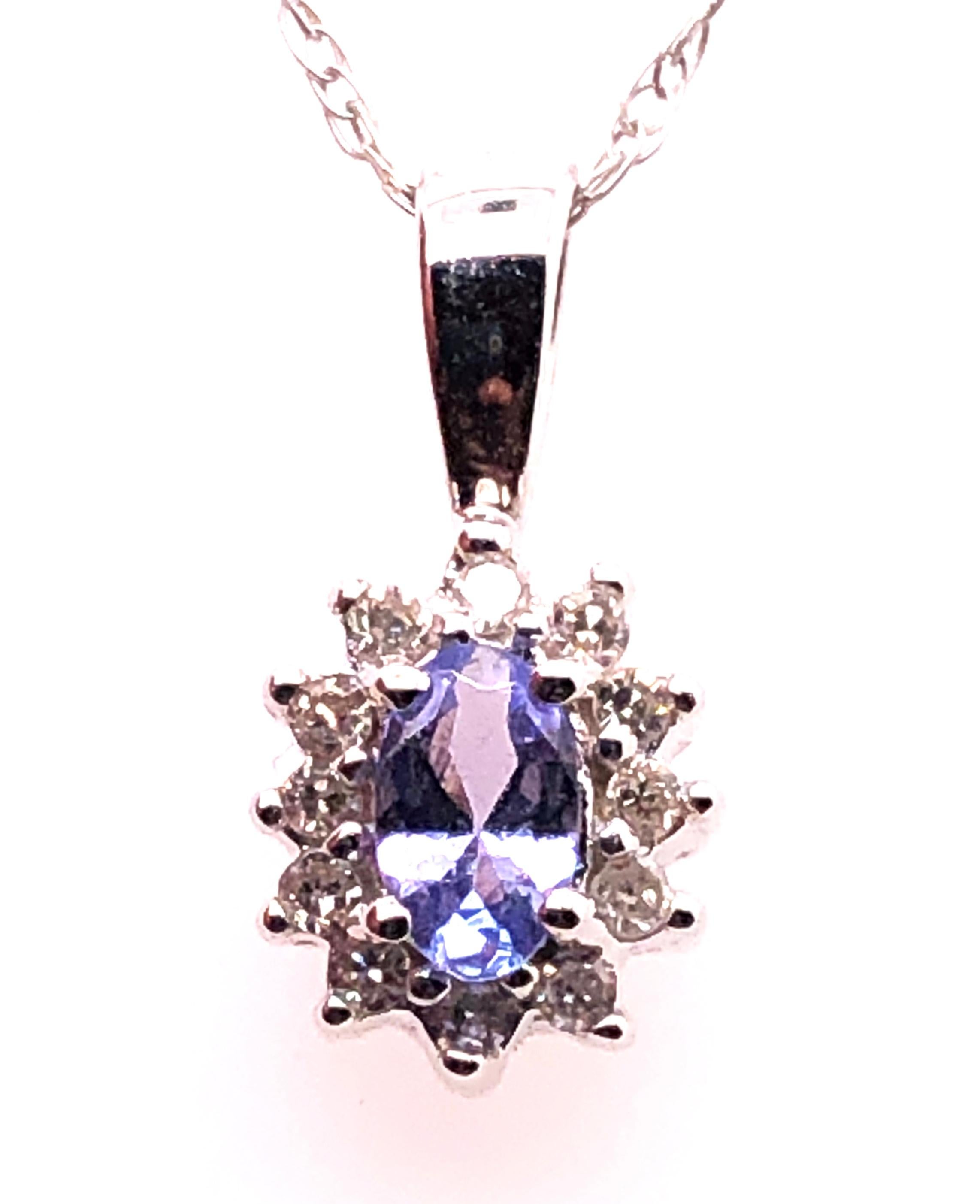 Women's or Men's 14 Karat White Gold Necklace with Diamonds and Oval Tanzanite Pendant For Sale