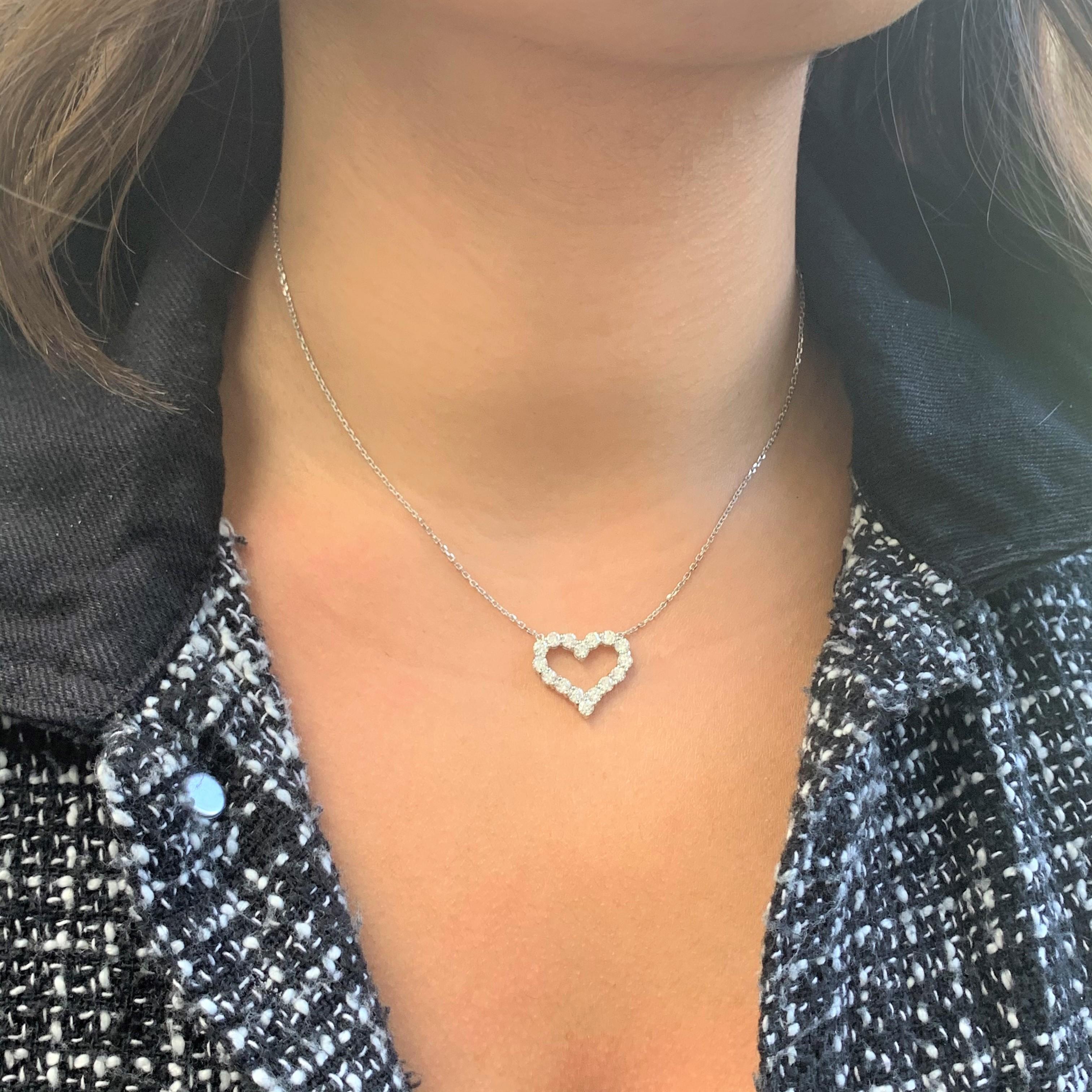 This is a Beautiful and Classic Heart Pendant crafted of 14K White Gold featuring 16 Natural Round White Diamonds weighing 1.60 carats. Hangs on an 18