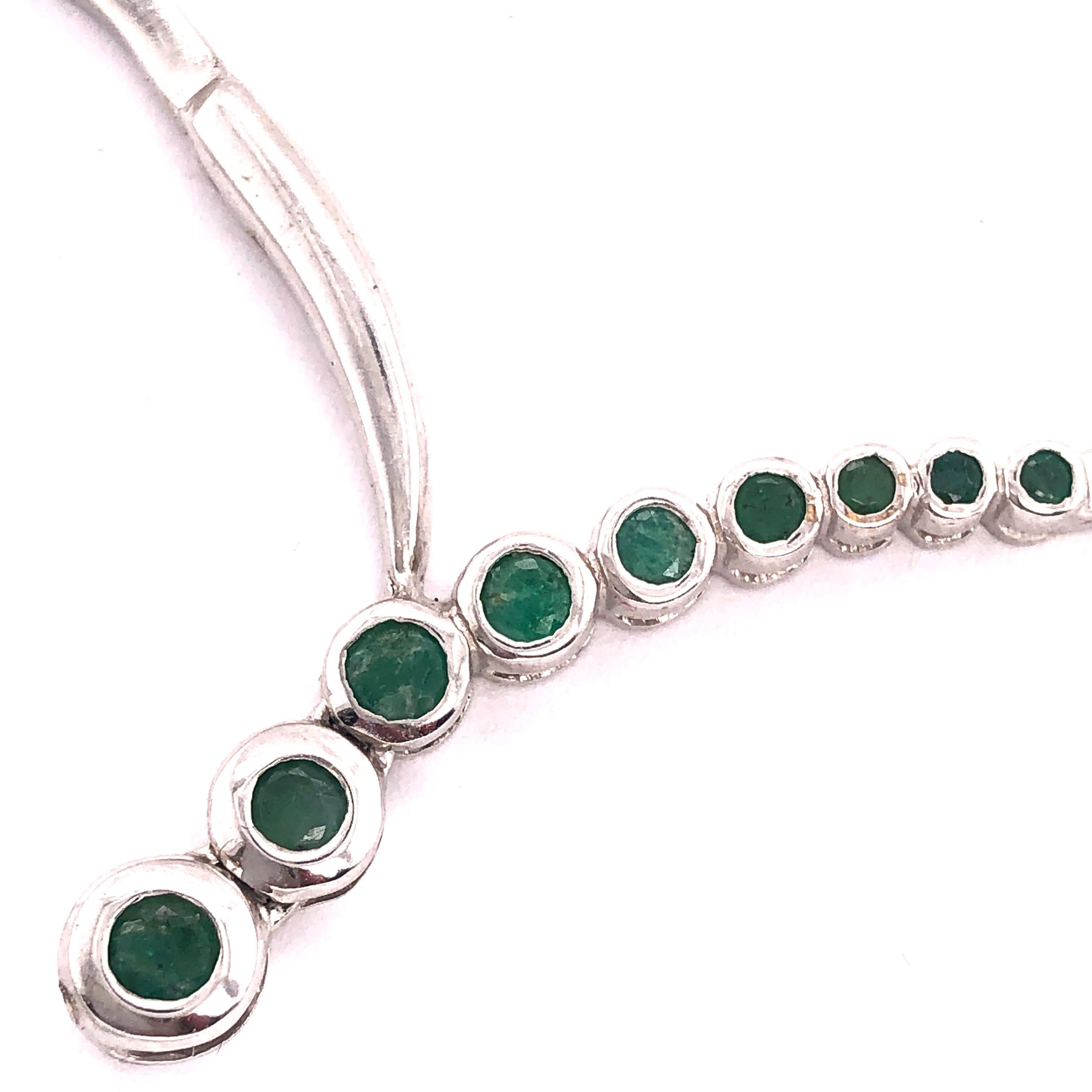 14 Karat White Gold 17 Inch Fashion Necklace with Round Emeralds.
18.4 grams total weight.