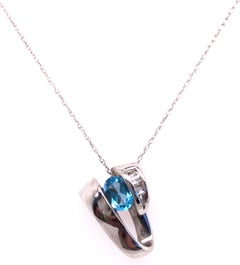 14 Karat White Gold Link with Oval Blue Topaz and Baguette Diamonds