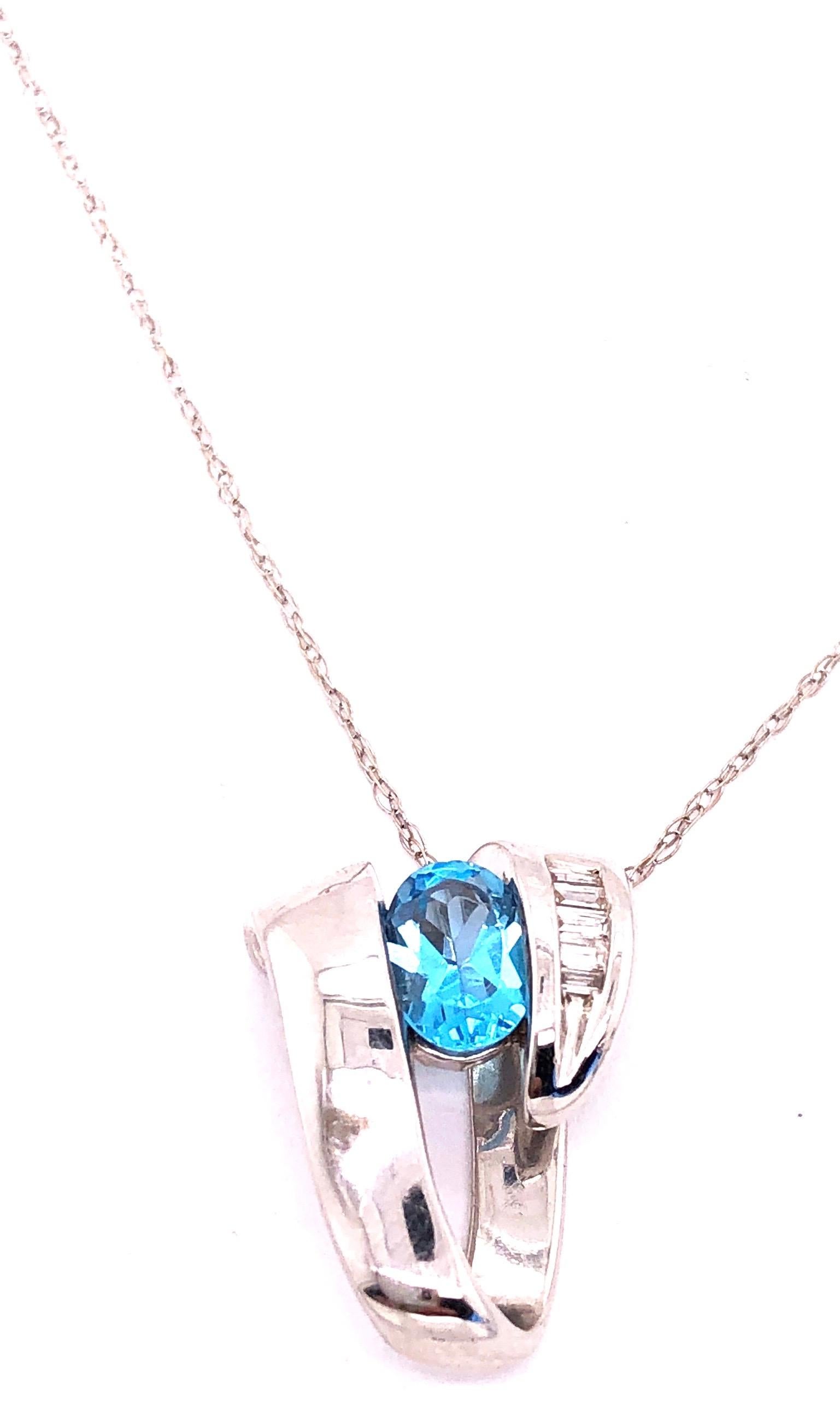A Link in oro bianco 14 carati con topazio blu ovale e diamanti baguette In condizioni buone in vendita a Manhasset, NY