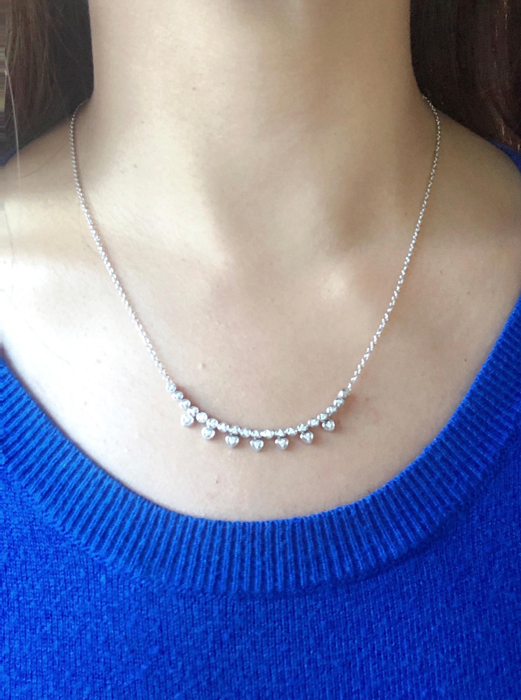 14 Karat White Gold 18 Inch Fancy Necklace with Diamonds. 26 piece total diamonds.  6.12 gram total weight.
This Italian necklace can be used as a choker or as seen in the photographs. 