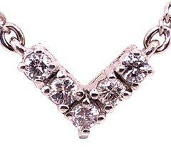 Collier en or blanc 14 carats avec pendentif en diamants