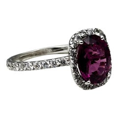 14 karat white gold, 2 carat purple Tourmaline and .95 carat diamond halo ring