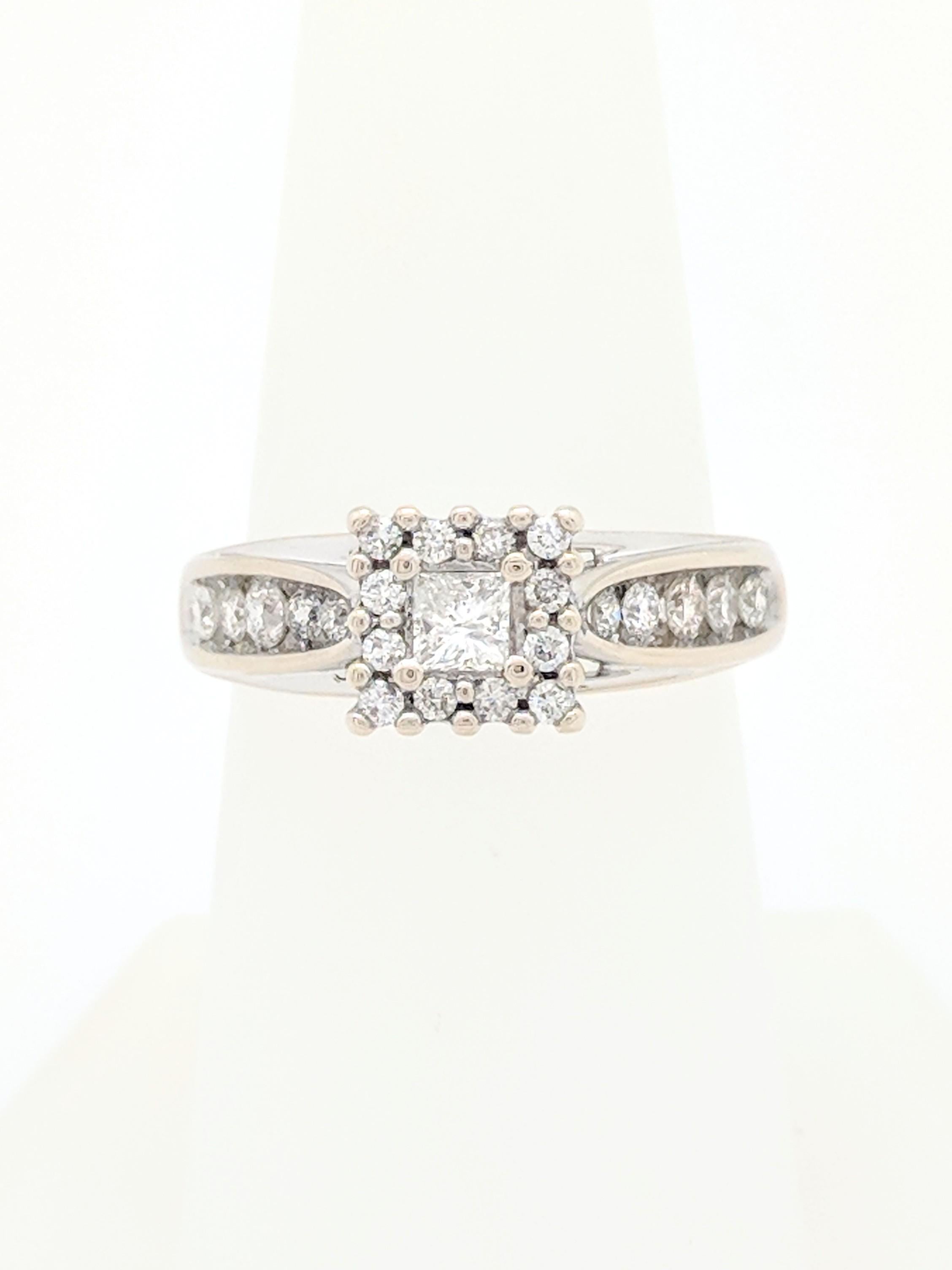 You are viewing a .20ct natural princess cut diamond set in a halo engagement ring. The center stone is beautifully displayed in a 14k white gold diamond halo engagement ring. We estimate this setting to be .40ctw. Total carat weight of engagement