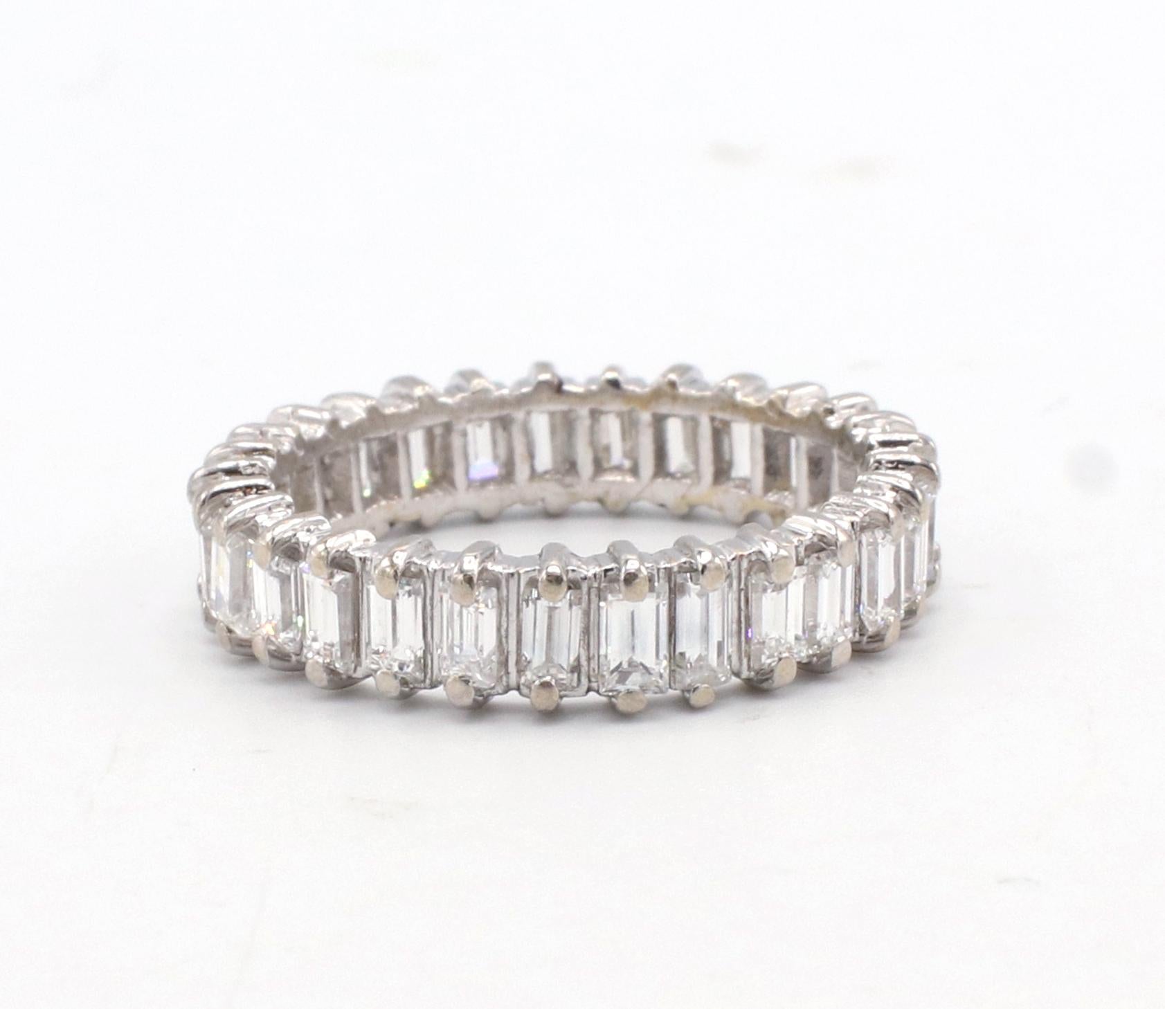 14 Karat White Gold 2.00 Carat Baguette Diamond Eternity Band Ring 
Metal: 14k white gold
Weight: 3.48 grams
Diamonds: Approx. 2.00 carat baguette G-H VS diamonds
Size: 7 (US)
Width: 4.5mm
