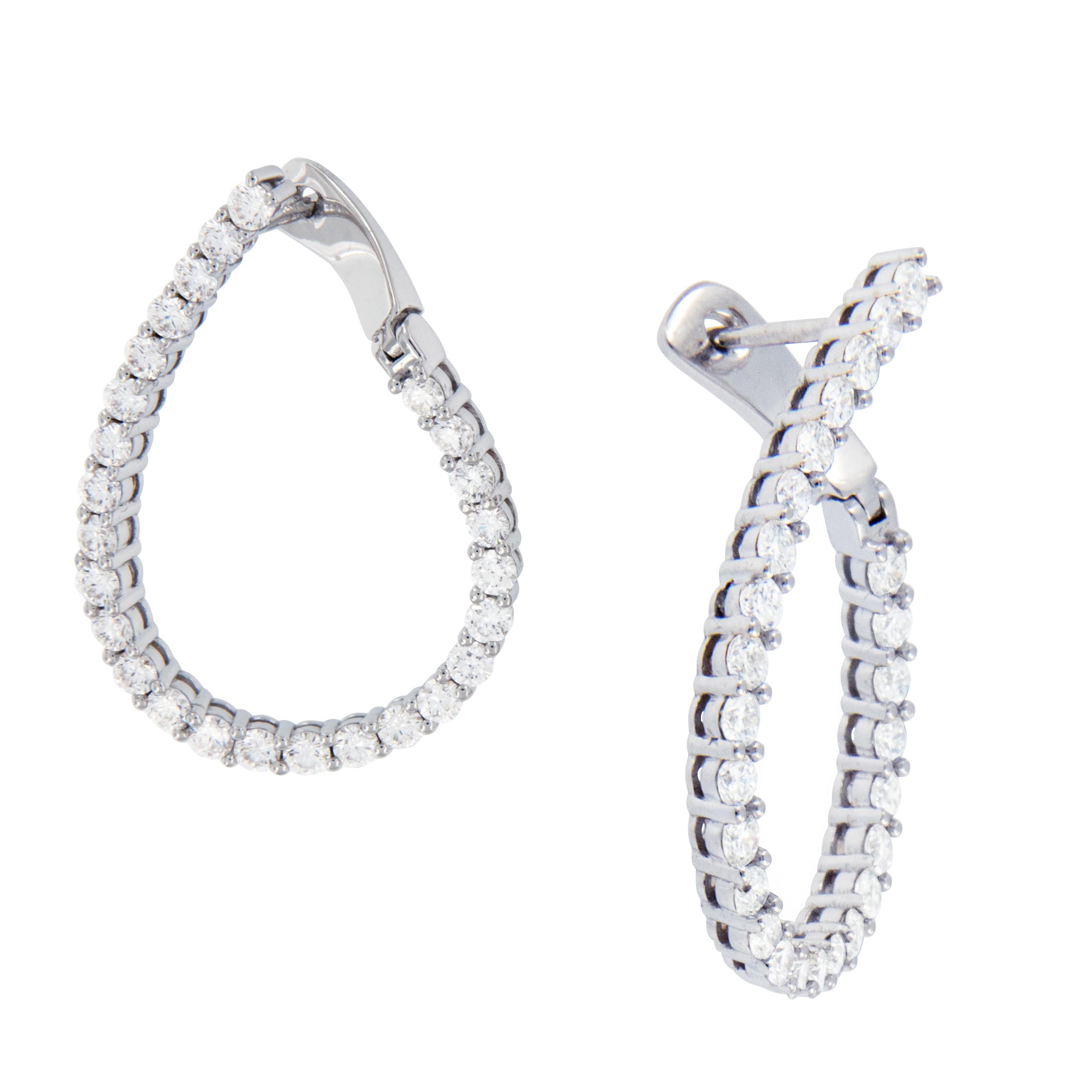 Why be like everyone else when you can stand out with these gorgeous earrings? 18 karat white gold inside / outside diamond hoops in East - West fashion with 2.33 Cttw VS, F-G diamonds are the perfect accessory to any outfit! Earrings have posts &