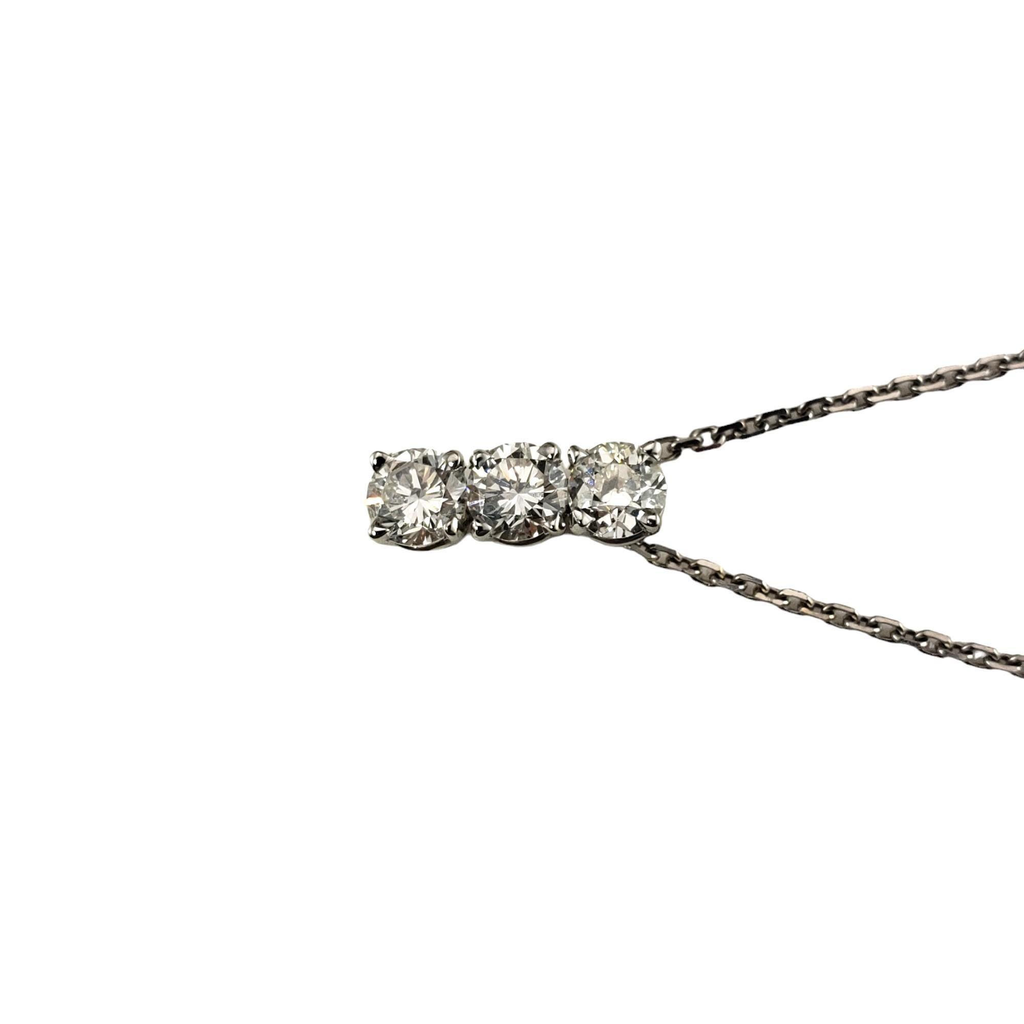 Vintage 14 Karat White Gold Diamond Pendant Necklace-

This sparkling pendant features two round brilliant cut diamonds and one European cut diamond suspended from a classic cable necklace.

Approximate total diamond weight: 1.32 ct.

Diamond color: