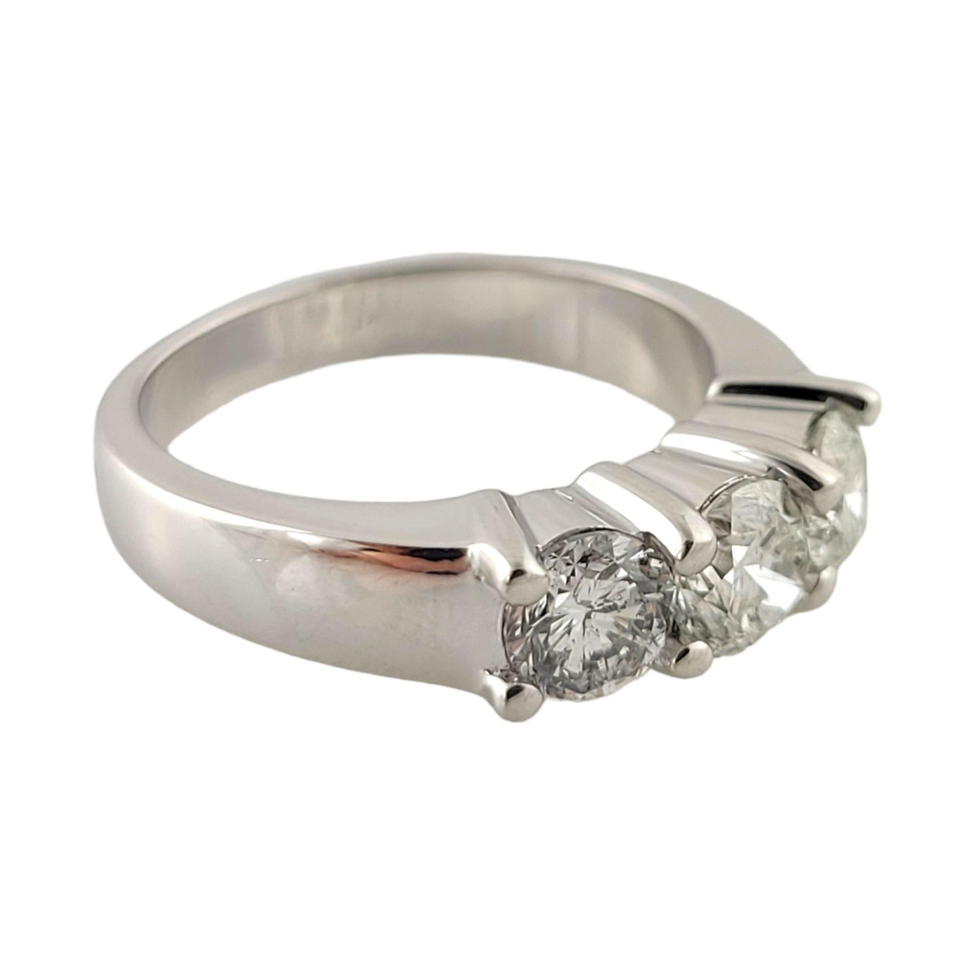 14K White Gold Three Diamond Ring

Three round brilliant diamonds are set in a white gold band.

Diamonds are approx. .40cts, .50 cts, and .42 cts for a total of approx. 1.32cts.

Diamond Clarity: I1-I2
Diamond Color: I

Size 6.75

6.5g / 4.2