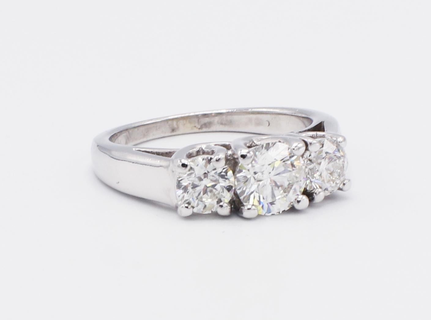 Vintage 14K White Gold 3 Stone Round Brilliant Cut Diamond Engagement Ring Size 6

Metal: 14k white gold
Diamonds: 3 round brilliant cut diamonds. Approx. 1.40 CTW I I1. Center stone is approx. .75 cts, the two side stones are approx. .33 cts 
Size: