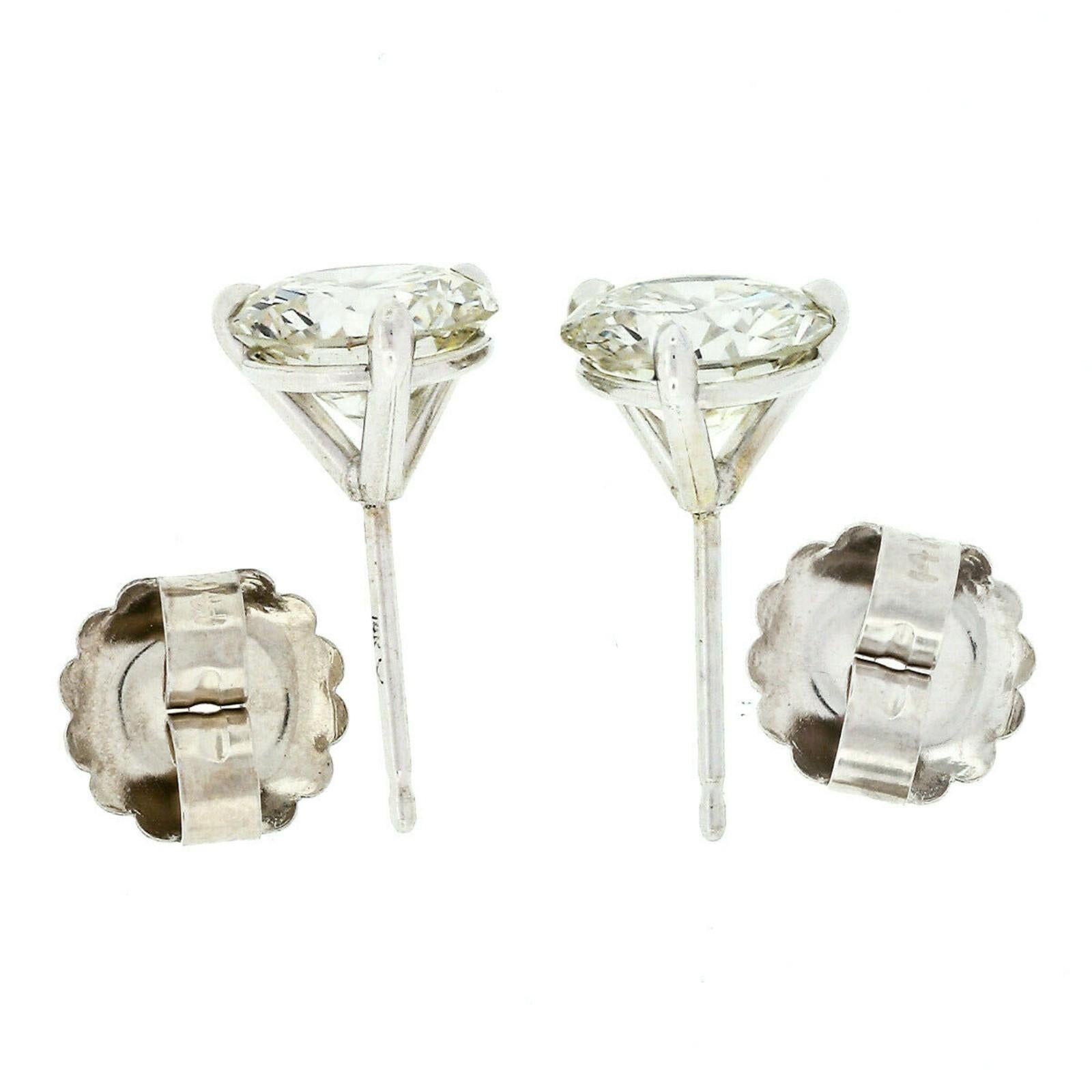 Round Cut 14 Karat White Gold 3.03 Carat Martini Prong Set GIA Round Diamond Stud Earrings For Sale