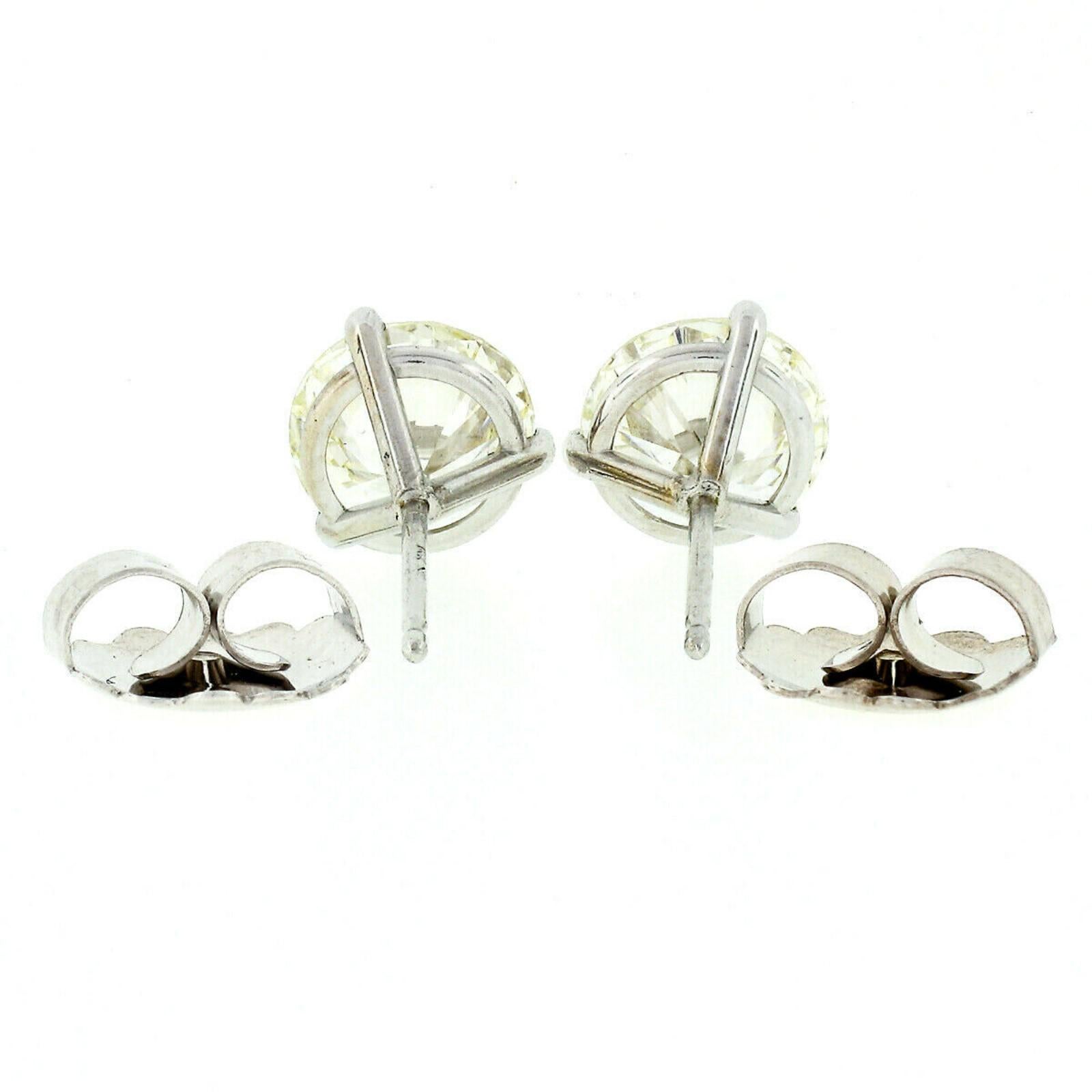 Women's 14 Karat White Gold 3.03 Carat Martini Prong Set GIA Round Diamond Stud Earrings For Sale