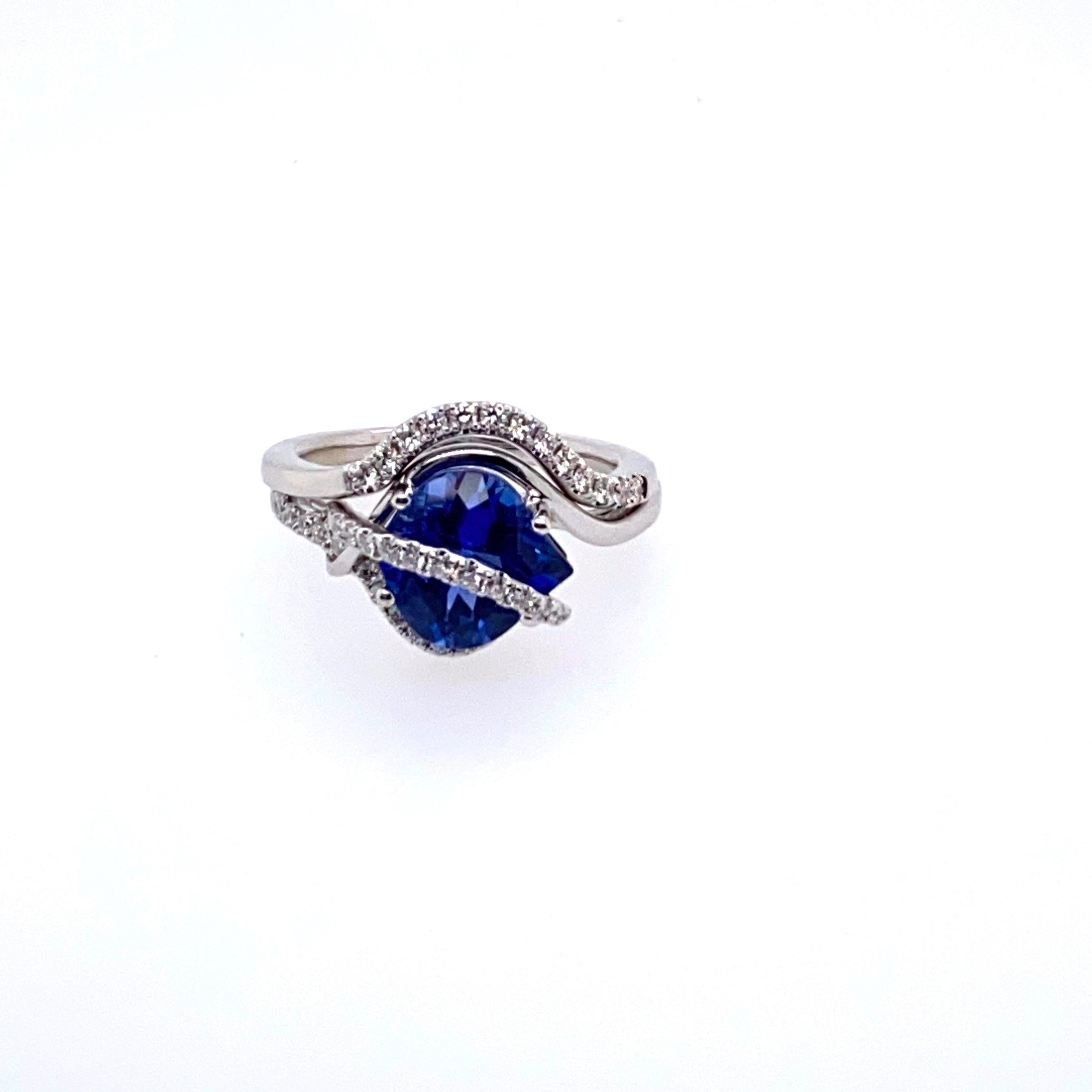 One 14 karat white gold 3.06 carat onion shaped Chatham sapphire set in a modern mounting, prong set with twenty-seven round brilliant diamonds, 0.21 carat total weight with matching H/I color and SI1/SI2 clarity.  The shank measures 1.3mm near the