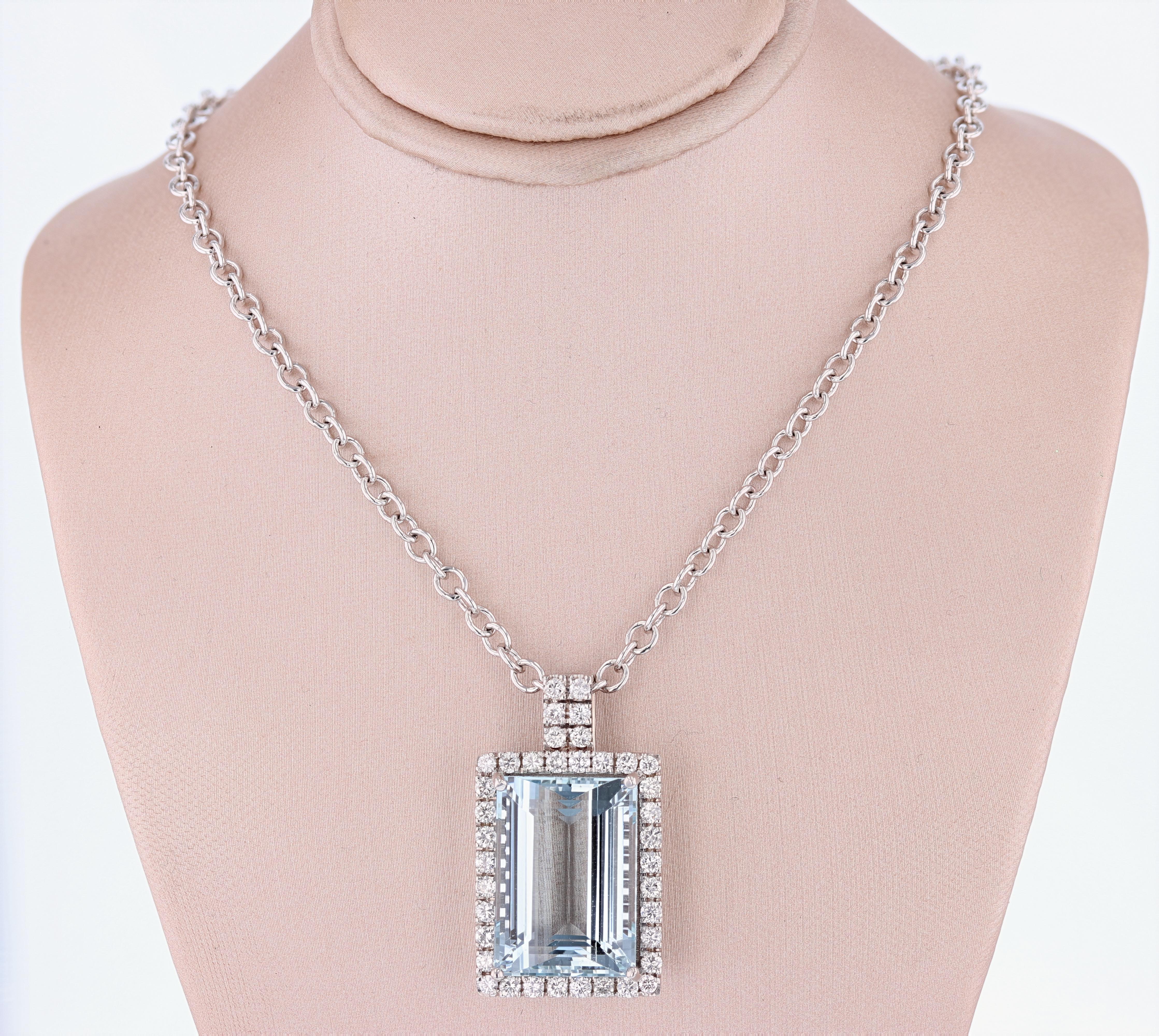 The pendant is made in 14 karat white gold and features a 31.51 carat GIA certified (certification number: 2165366599) set surrounded by round cut diamonds weighing 1.75c total weight color grade (G) clarity grade (VS1/VS2) prong set. 

The chain is