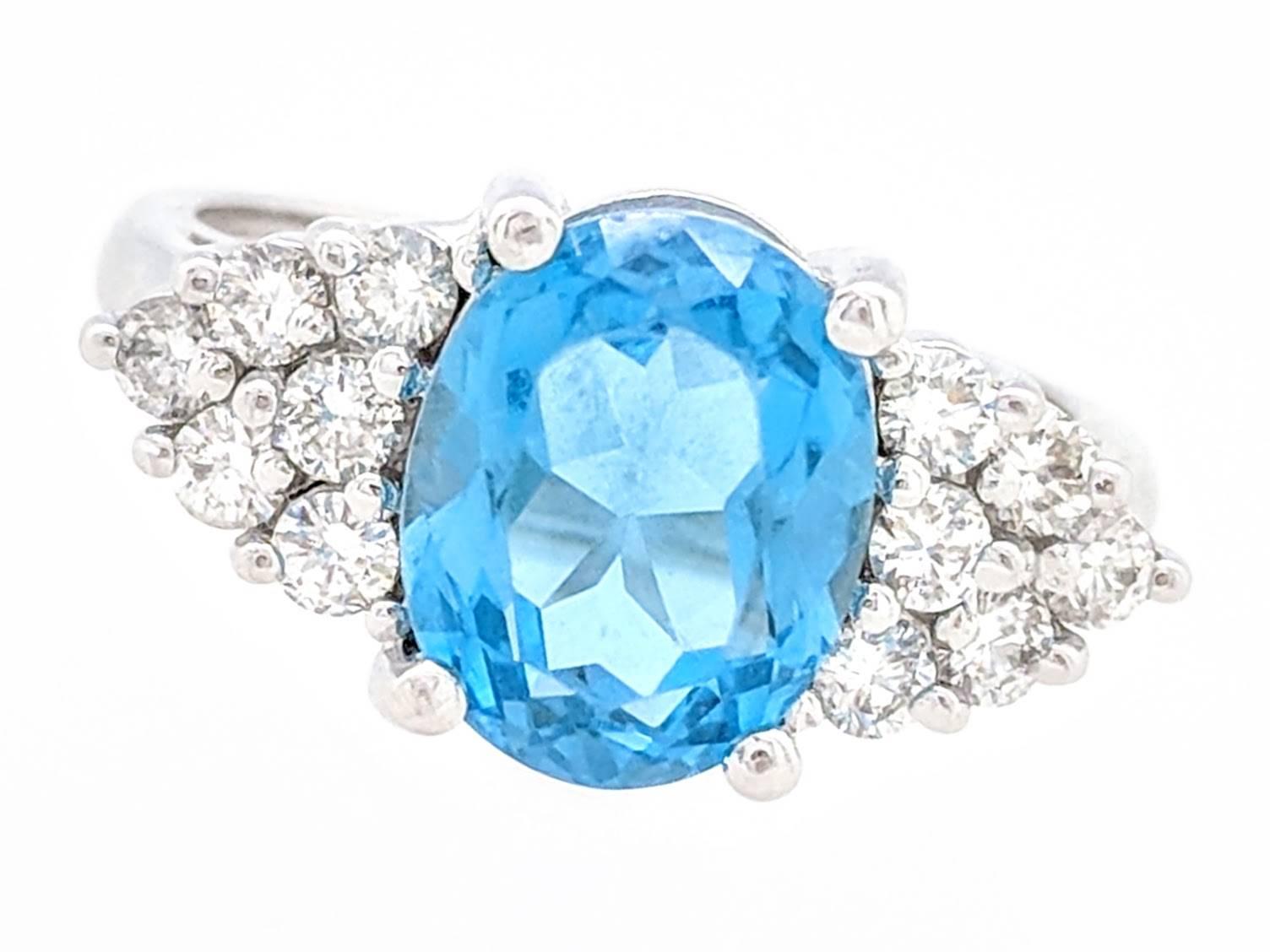 Contemporary 14 Karat White Gold 3.50 Carat Blue Topaz and Diamond Cocktail Ring For Sale