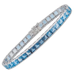 Bracelet tennis à maillons en or blanc 14 carats avec topaze bleue taille carrée de 4 mm