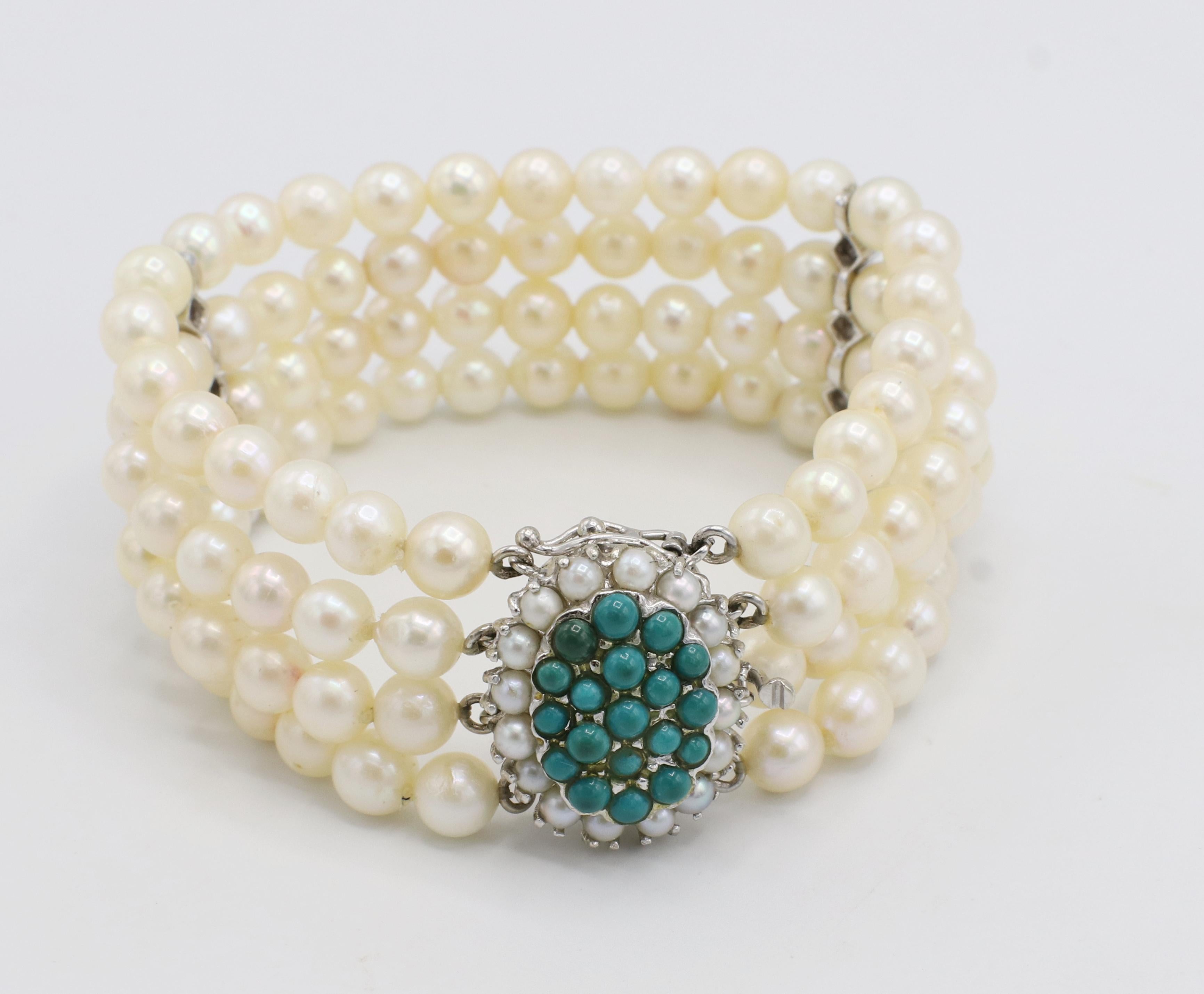 14 Karat White Gold 4-Row Pearl Bracelet With Turquoise Stations & Clasp
Metal: 14k white gold
Weight: 40.76 grams
Pearls: 5.8-6mm white cultured pearls 
Length: 6.5 inches
Width: 1 inch
