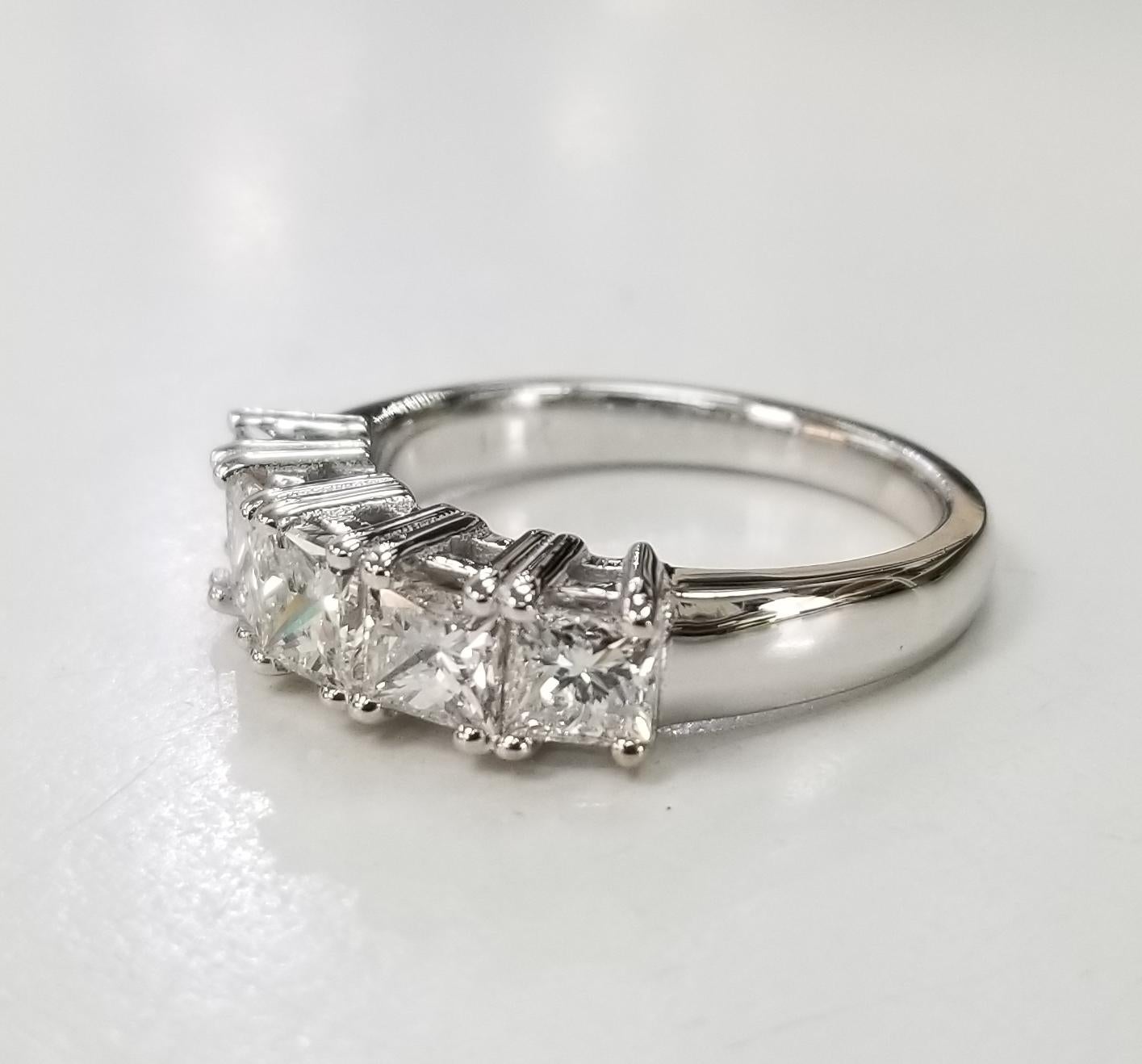 14k white gold 5 princess cut diamonds anniversary wedding ring, containing 5 princess cut diamonds; color F-G, clarity VS2-SI1 and  weight 2.05 cts. (average size diamonds.40pts.) ring size is 6.75 and can be sized to fit for free.