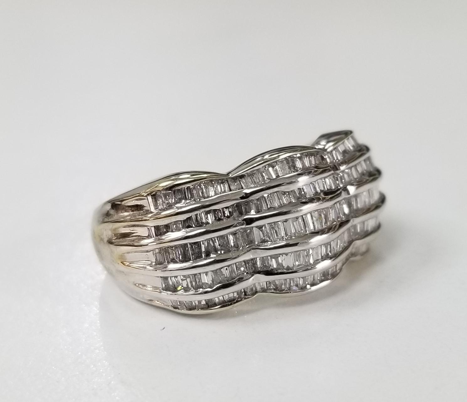 14 karat white gold 5 row diamond baguette channel set ring, containing 140 baguette cut diamonds of very fine quality weighing 1.80cts.  This ring is a size 8 but we will size to fit for free.