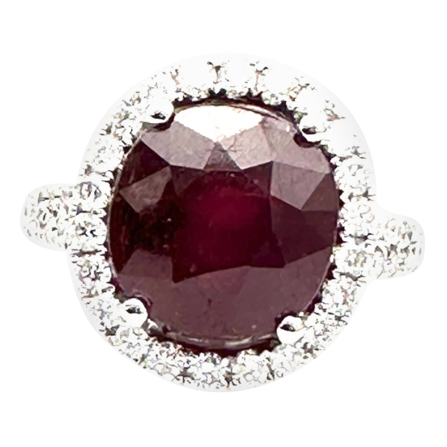 14k White Gold 5.00ct Oval Ruby and 1.00ct Diamond Halo Ring For Sale