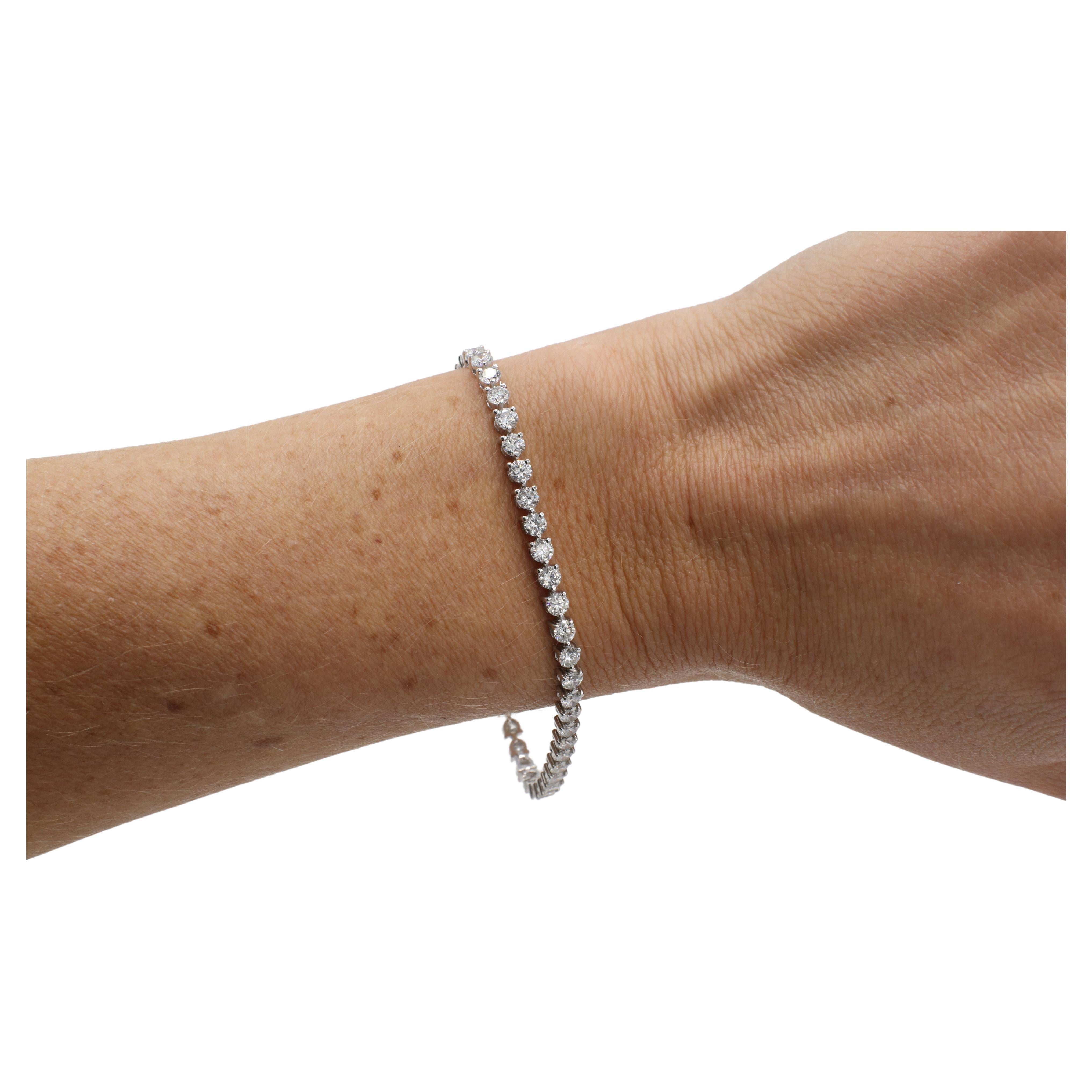 14 Karat White Gold 5.44 Carat Natural Diamond Tennis Line Bracelet 
Metal: 14k white gold
Weight: 8.06 grams
Diamonds: 5.44 CTW round natural diamonds G-H VS-SI
Length: 7 inches
Width: 3mm

