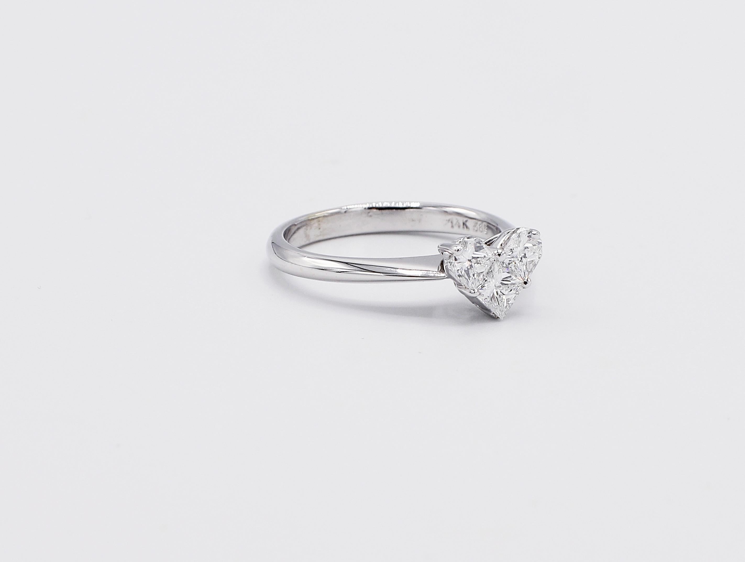 14 Karat White Gold Diamond Heart Cluster Ring Size 5
Metal: 14k white gold
Weight: 2.32 grams
Diamonds: 1 princess cut diamond and 2 half moon shaped diamonds, approx. 0.60 F-G VS
Top of ring measures 8 x 6mm
Size: 5 (US)
Band is 2.2mm at base