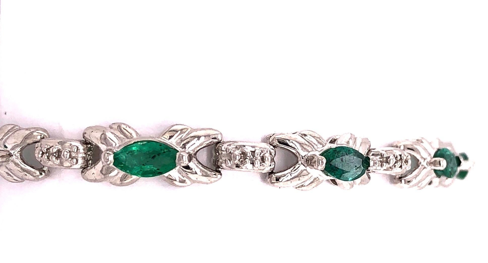 Modern 14 Karat White Gold Emerald Bracelet with Round Diamonds