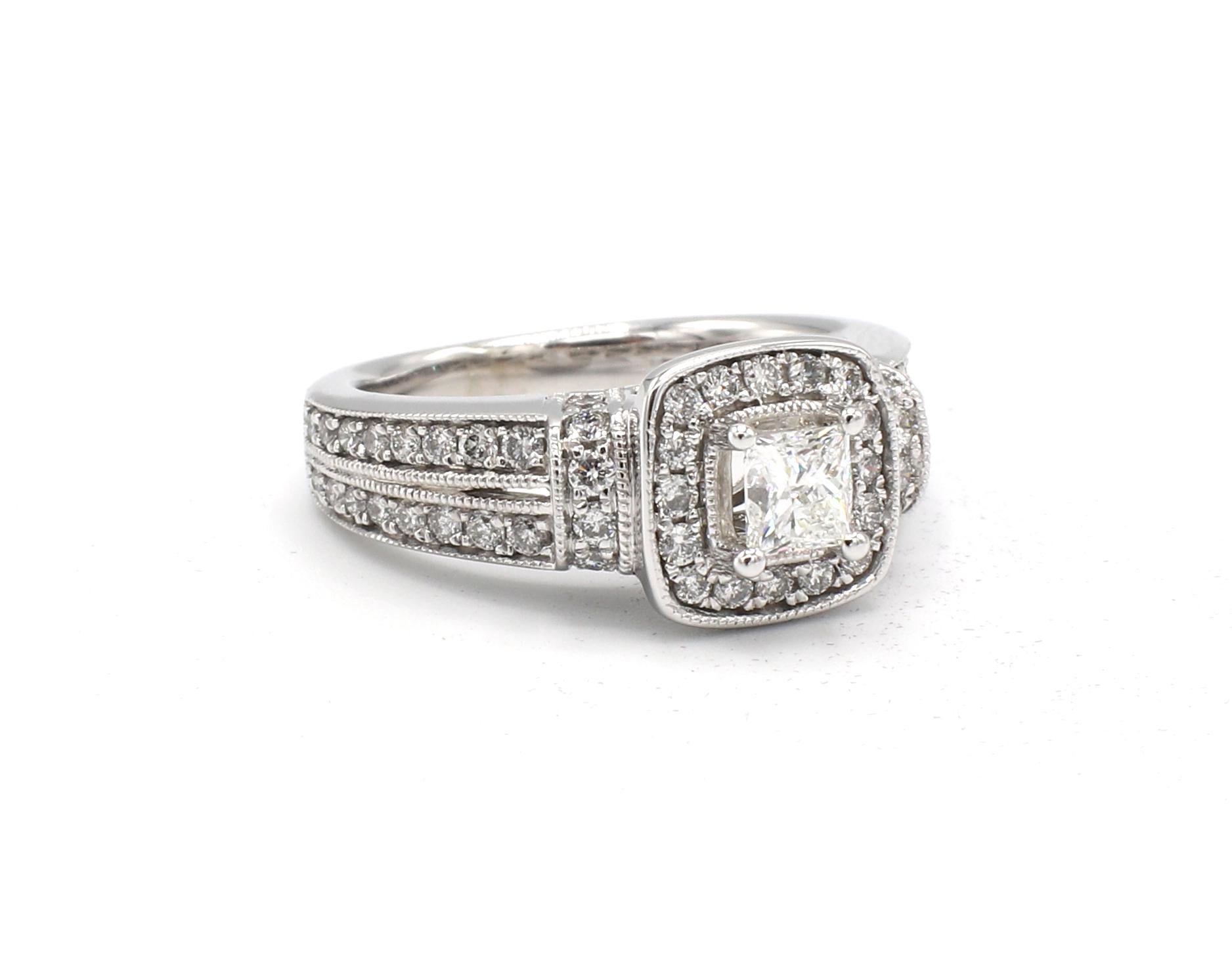 14 Karat White Gold .90 Carat Princess Cut & Round Diamond Halo Engagement Ring

Metal: 14k white gold
Weight: 4.96 grams
Diamonds: Approx. .90 CTW, 1 princess cut diamond approx. .30 CT, 56 round diamonds approx. .60 CTW G VS
Size: 5 (US)
Top of