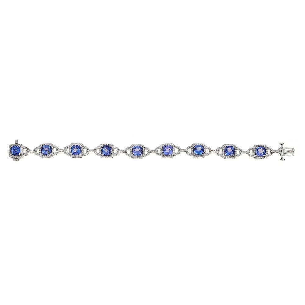 This finely executed tanzanite and diamond bracelet is crafted in 14k white gold.
