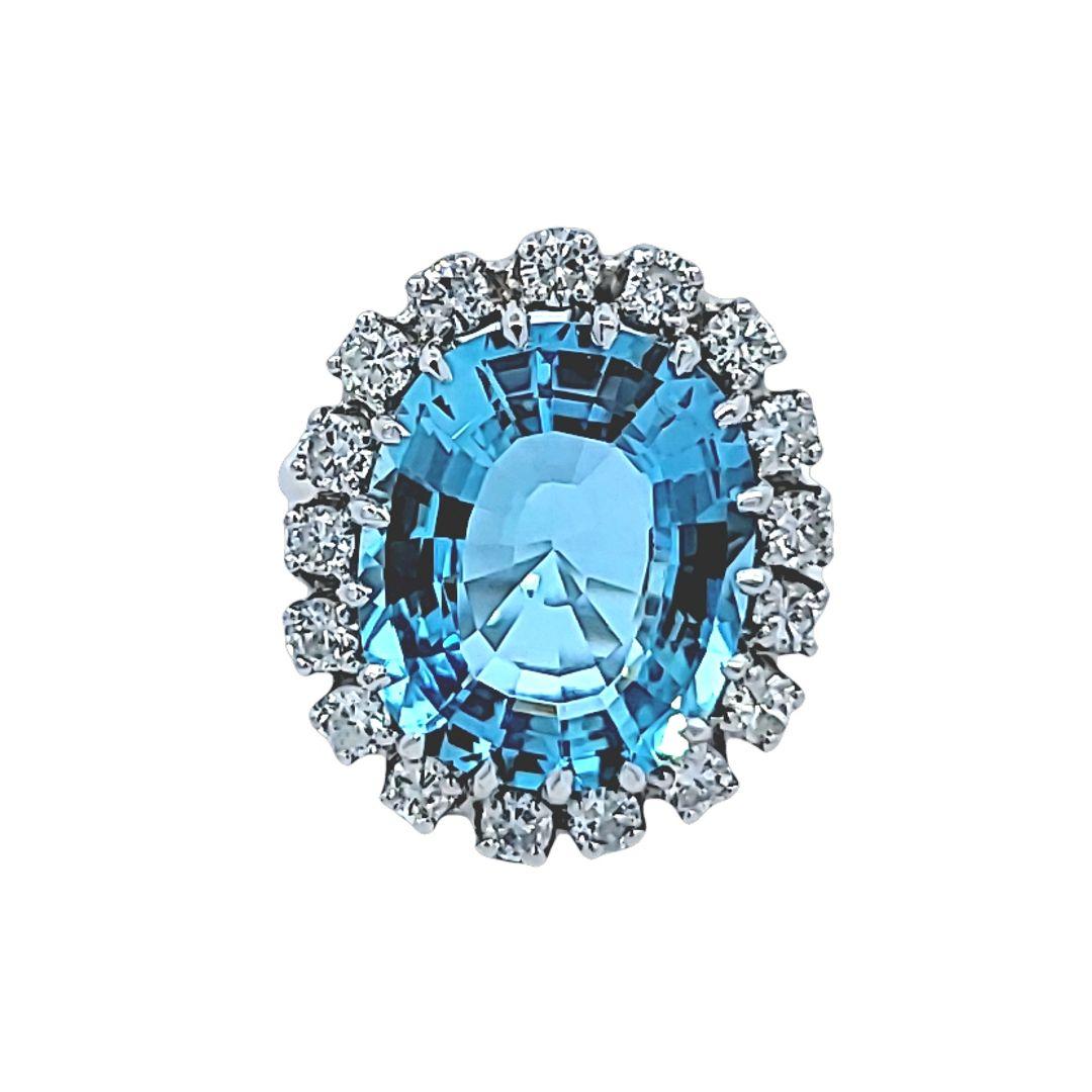 This lovely blue aquamarine ring is in 14 karat white gold and is centered with a stunning 9.00 carat aquamarine which is surrounded by round brilliant diamonds.  The estimated total weight of the diamonds is 1.35 cts. 