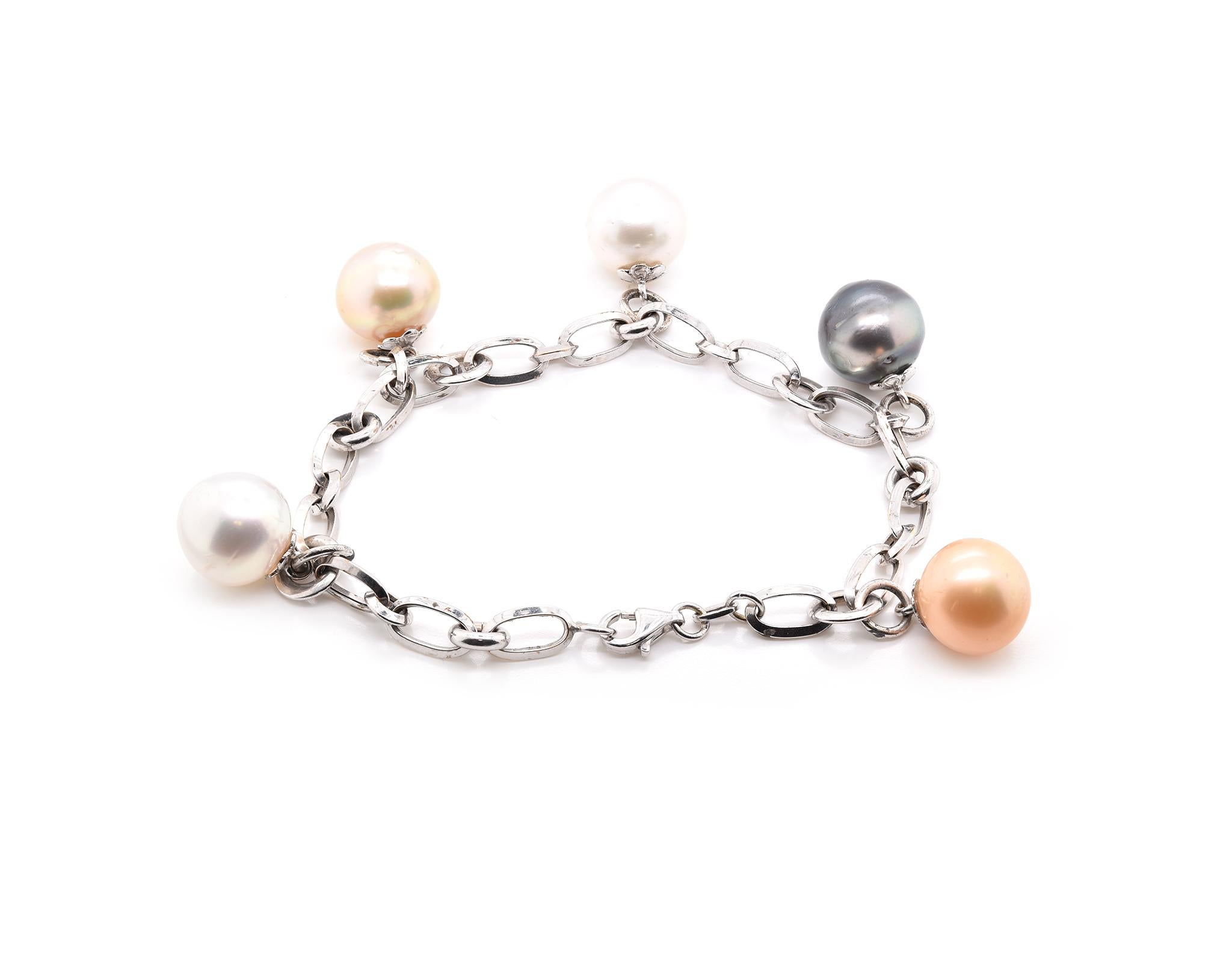 Designer: custom
Material: 14K white gold 
Pearls = 12.3mm
Dimensions: bracelet measures 8-inches long
Weight: 18.78 grams
