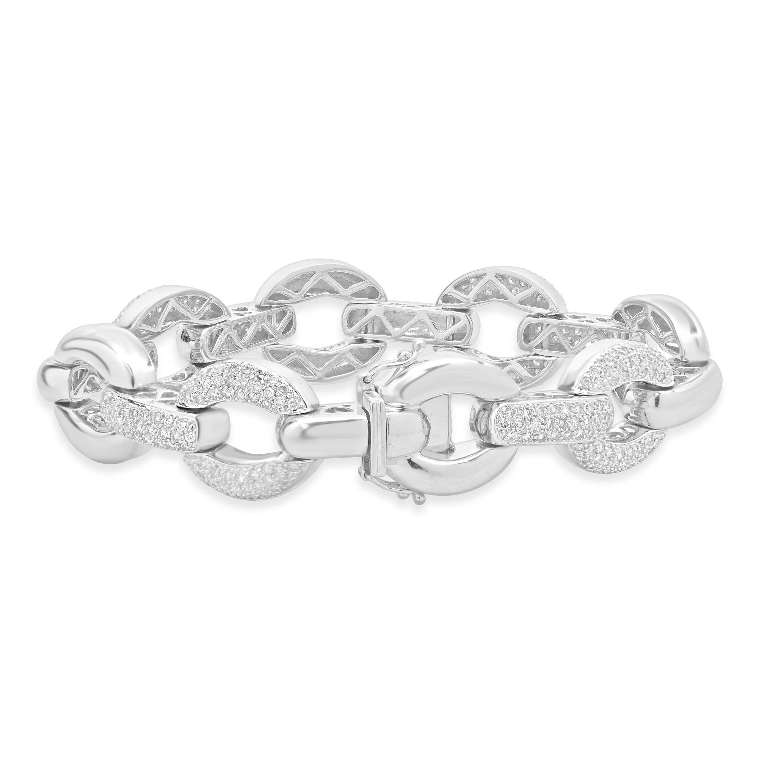Designer: custom design
Material: 14k white gold
Diamond: 308 round brilliant cut = 3.08cttw
Color: H
Clarity: SI2
Dimensions: bracelet will fit up to a 6.75-inch wrist
Weight: 39.23 grams
