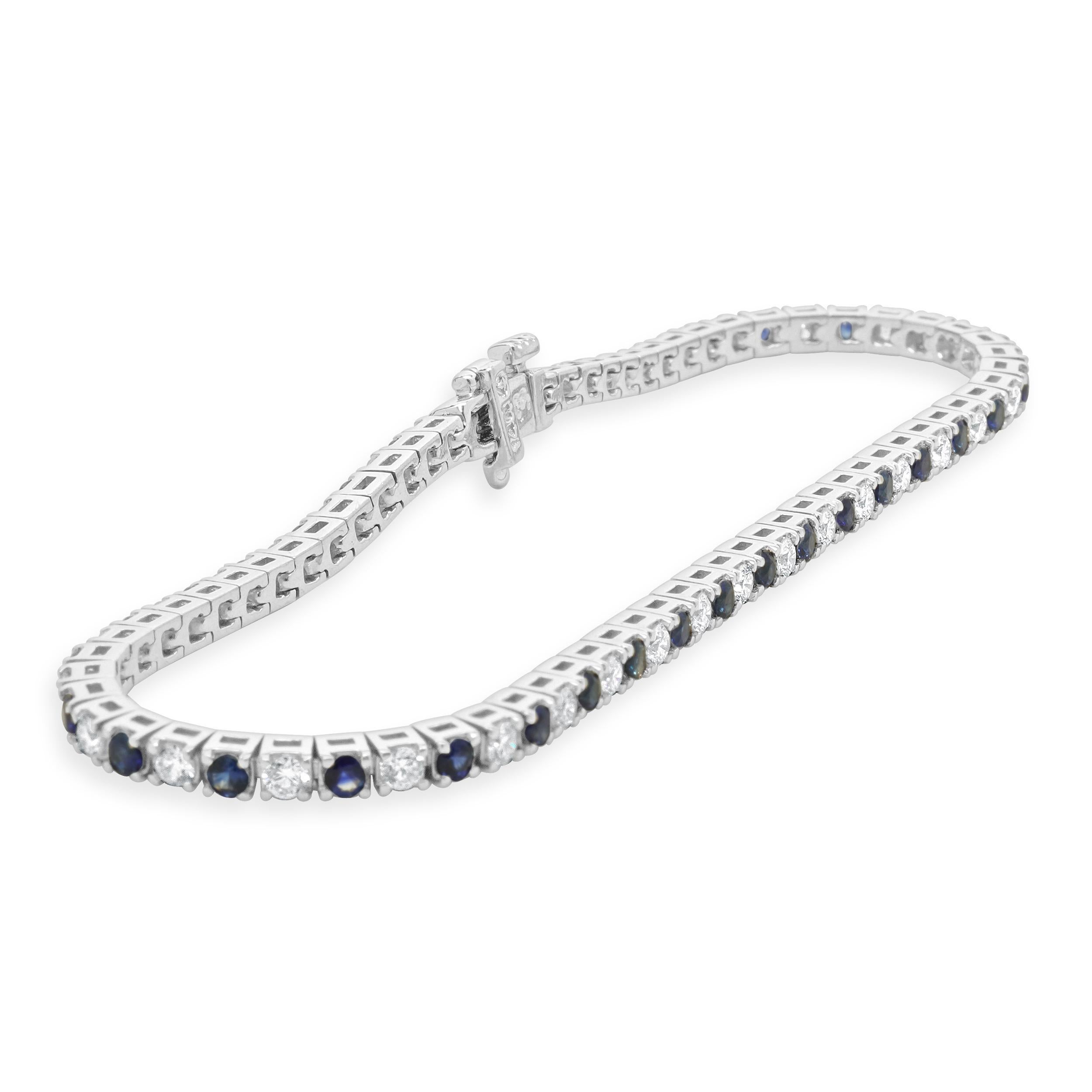 Designer: personalizzato
Materiale: oro bianco 14 carati
Diamante: taglio rotondo brillante = 1,50cttw
Colore: G
Chiarezza: SI1
Zaffiro: taglio rotondo = 2.42cttw
Lunghezza: il braccialetto si adatta a un polso di 7 pollici.
Peso: 9.43 grammi