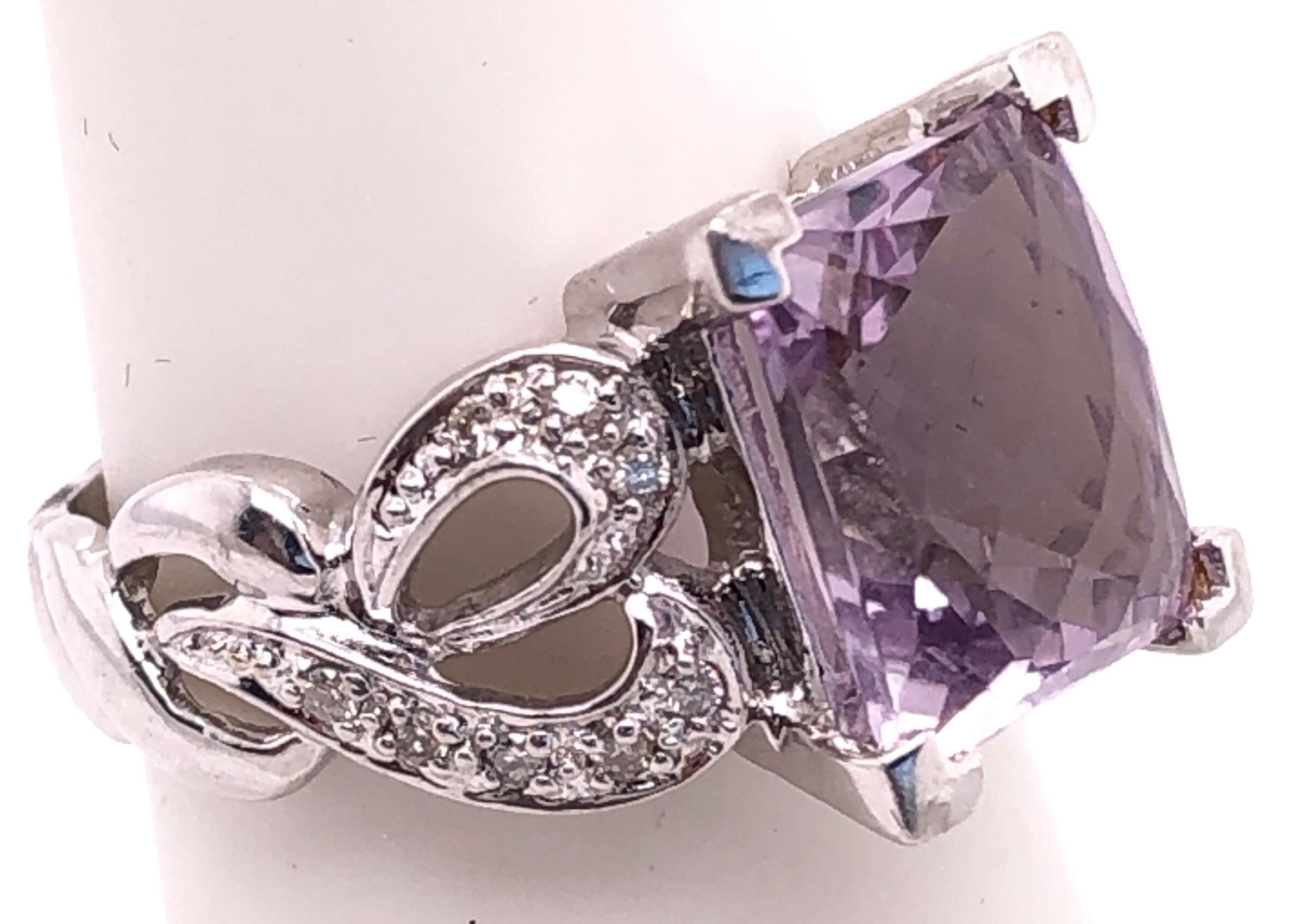 14 Karat White Gold Amethyst Solitaire Ring with Diamond Accents Size 5.
1.00 total diamond weight.
4.65 grams total weight.