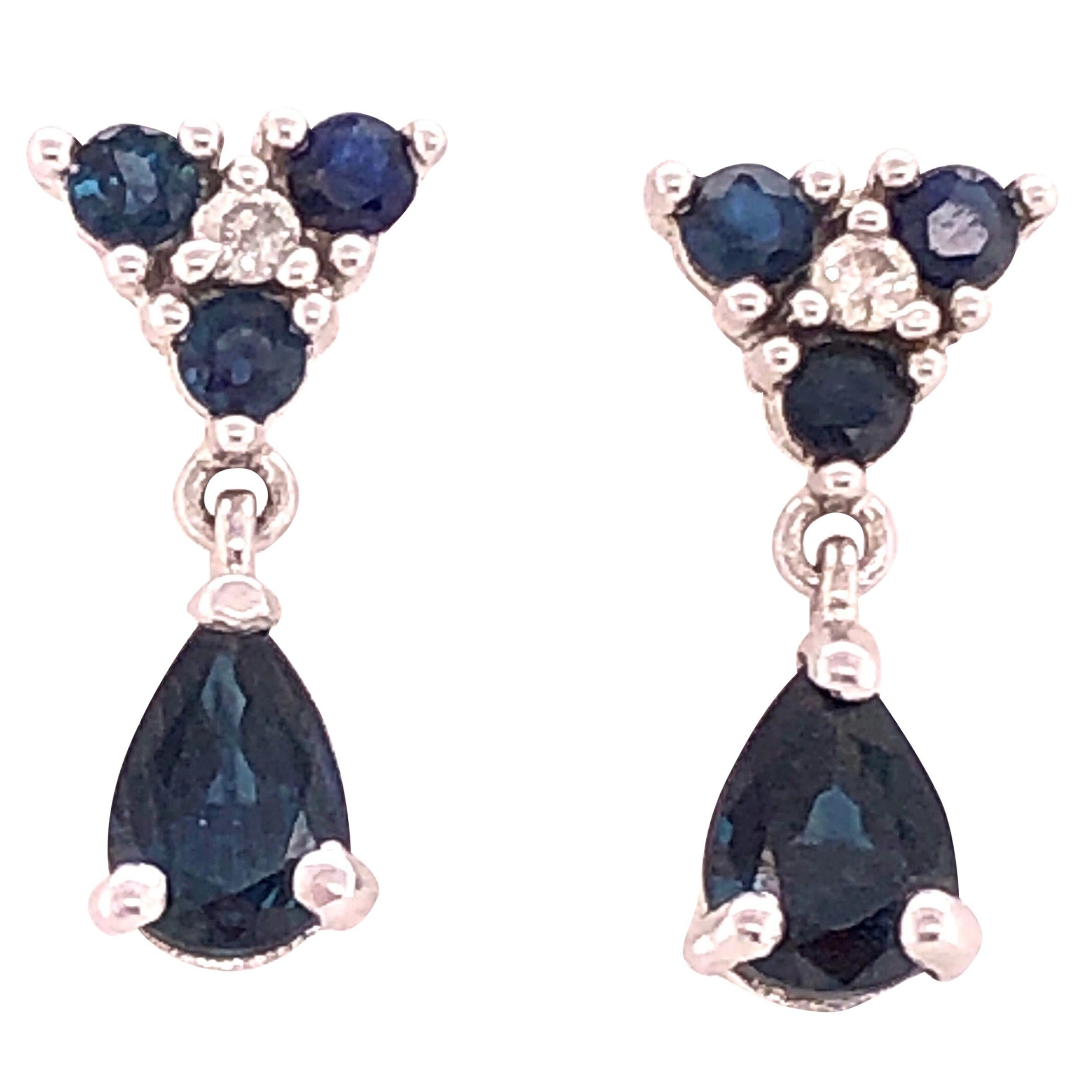 14 Karat White Gold and Blue Sapphire Drop Earrings 0.02 Total Diamond Weight For Sale