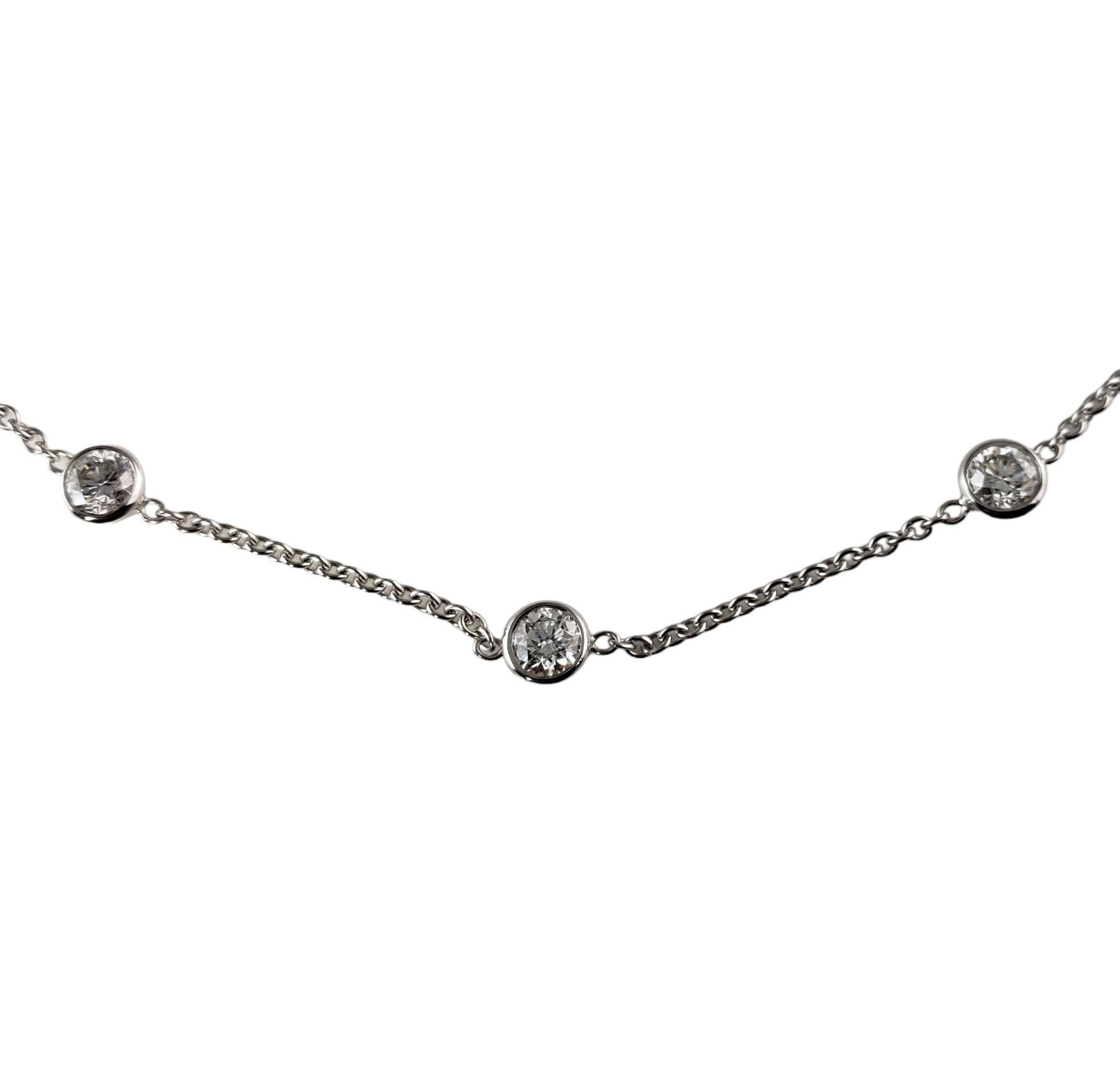 This sparkling anklet features nine round brilliant cut diamond set in classic 14K white gold.

Total diamond weight: 2.37 ct.

Diamond color:  G-H

Diamond clarity:  SI1-SI2

Stamped:  585

Size:  11.5 inches

Weight: 3.2 gr./ 2.0 dwt.

JAGi