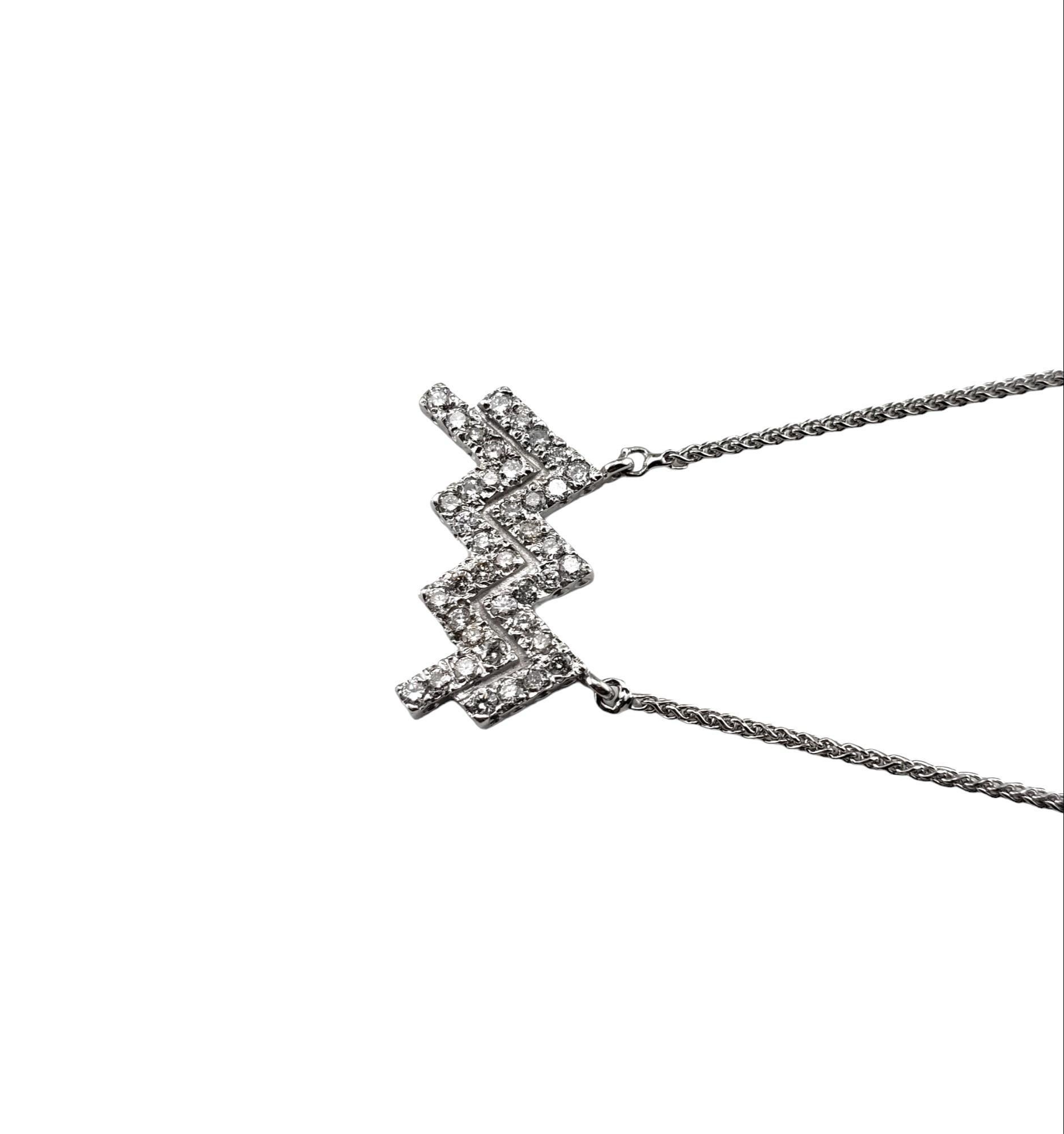 Vintage 14 Karat White Gold and Diamond Aquarius Pendant Necklace-

This sparkling Aquarius pendant features 40 round brilliant cut diamonds set in classic 14K white gold.  Suspends from a classic cable necklace.

Approximate total diamond weight: 