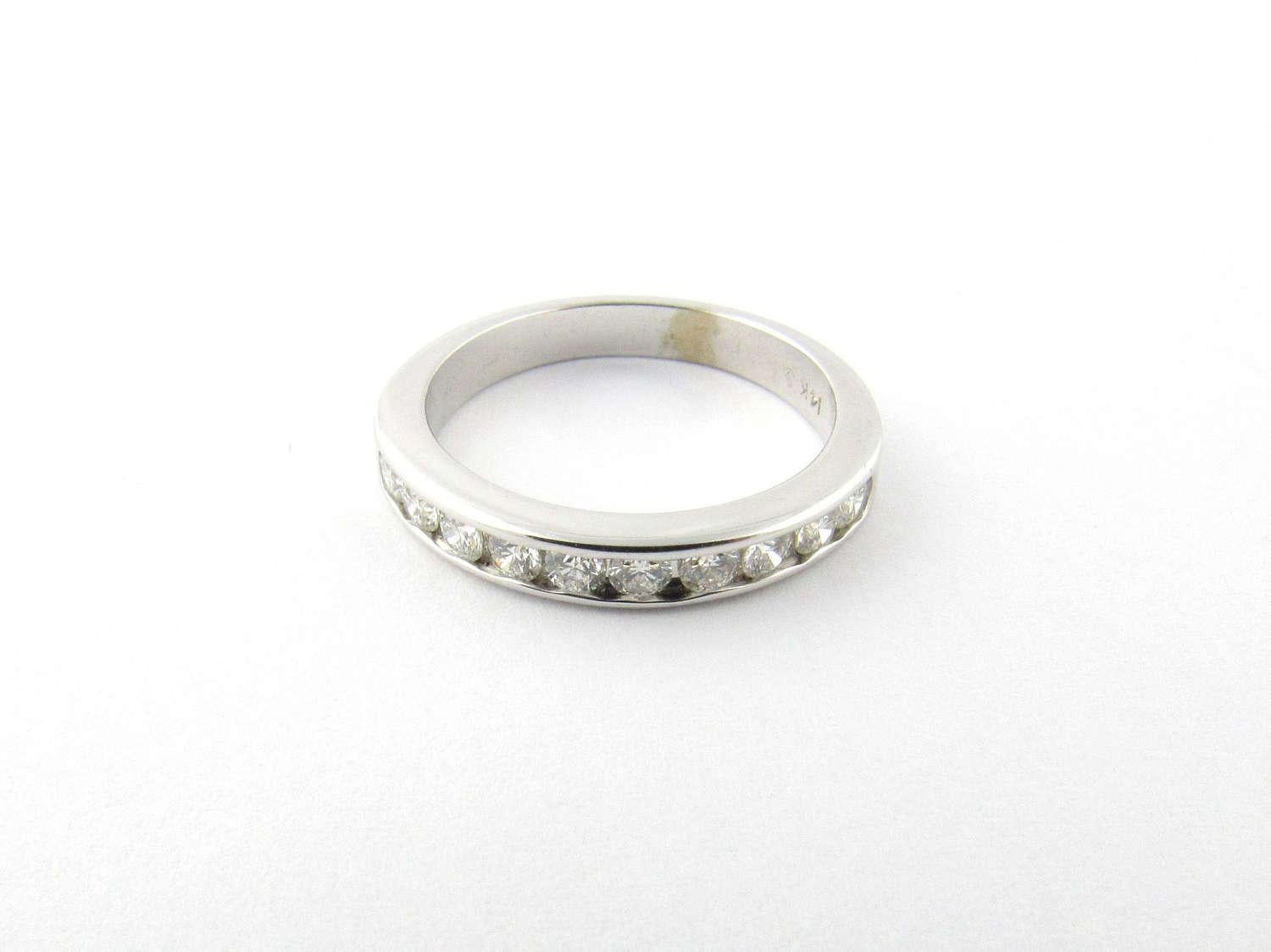 Vintage 14K White Gold and Diamond Band Size 7 

This white gold band is channel set with 10 diamonds. 

Approx. .40 carats total. SI clarity, J color 

Shank is approx. 3 mm wide. 

Hallmarked and stamped 14K 

2.3dwt / 3.7 g 

This ring will be