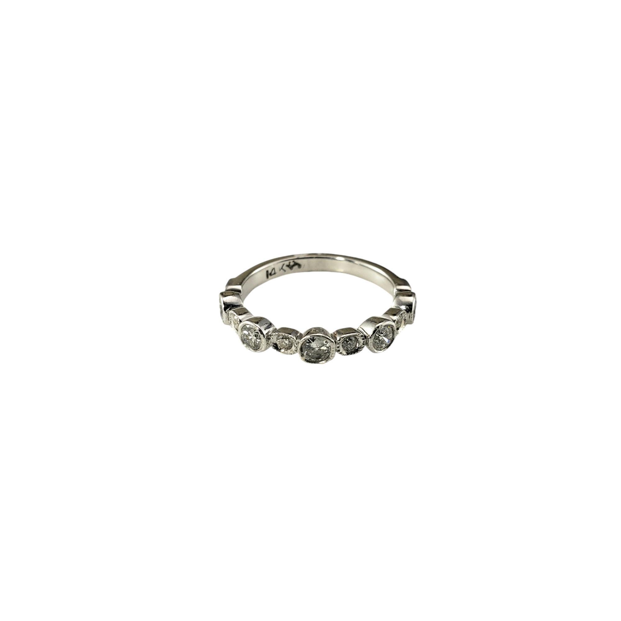 14 Karat White Gold and Diamond Band Ring Size 3

This sparkling band features 11 round brilliant cut diamonds set in classic 14K white gold.  Width: 3 mm.  Shank: 2 mm.

Approximate total diamond weight:  .36 ct.

Diamond color: I-K

Diamond