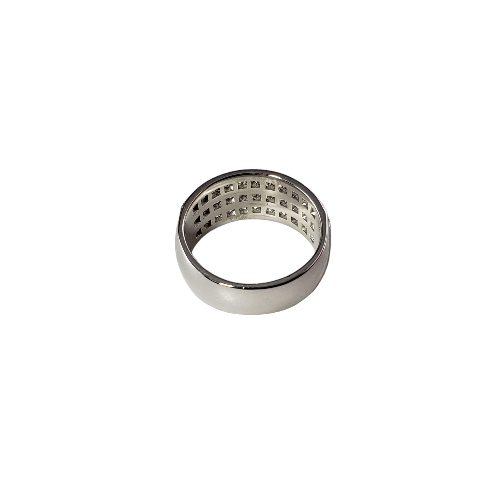 Vintage 14 Karat White Gold and Diamond Band Ring Size 4.75 JAGi Certified-

This sparkling three row ring features 33 round brilliant cut diamonds set in elegant 14K white gold. Width: 9 mm. Shank: 6 mm.

Total diamond weight: 1.0. ct.

Diamond