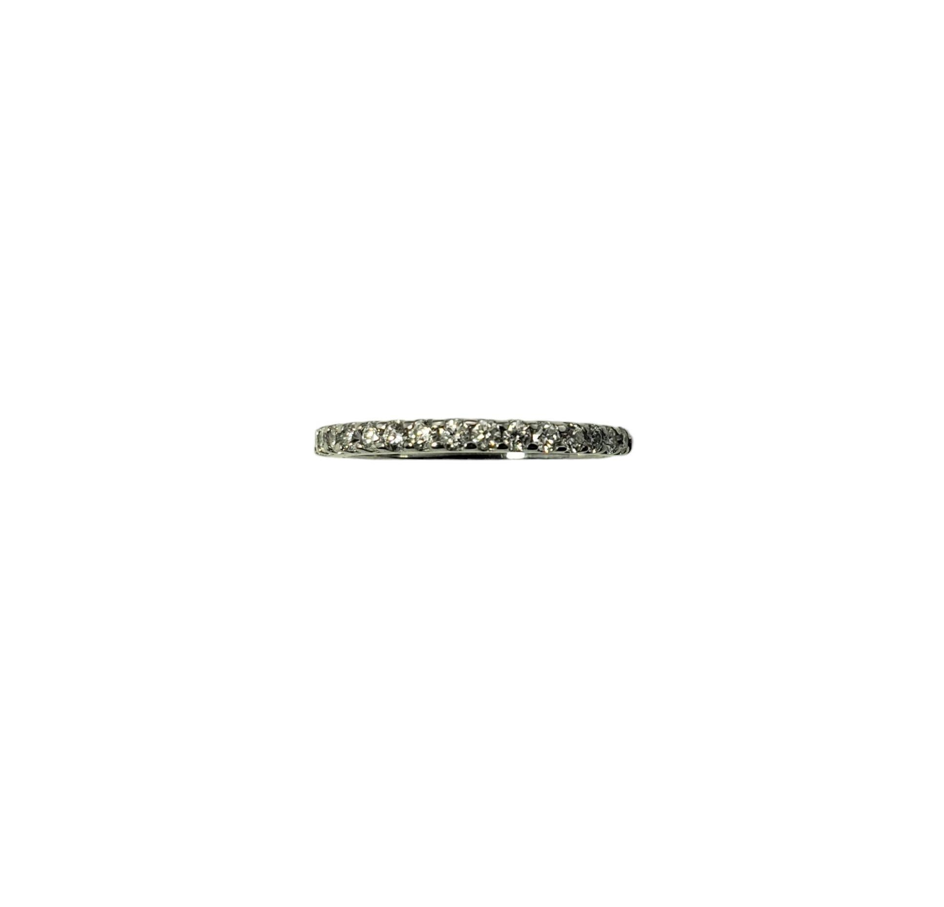Vintage 14 Karat White Gold and Diamond Band Ring Size 5-

This sparkling band features 17 round brilliant cut diamonds set in classic 14K white gold. Width: 2 mm.

Approximate total diamond weight: .34 ct.

Diamond clarity: I1

Diamond color: