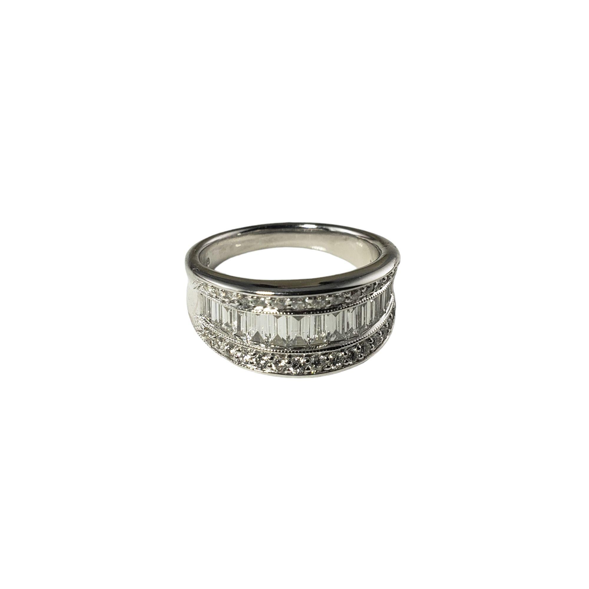 This sparkling band features 15 baguette diamonds and 30 round brilliant cut diamonds set in classic 14K white gold.  Width: 9 mm.

Shank: 3 mm.

Approximate diamond weight: . 74ct.

Diamond color: H-I

Diamond clarity: SI1-VS2

Ring Size: