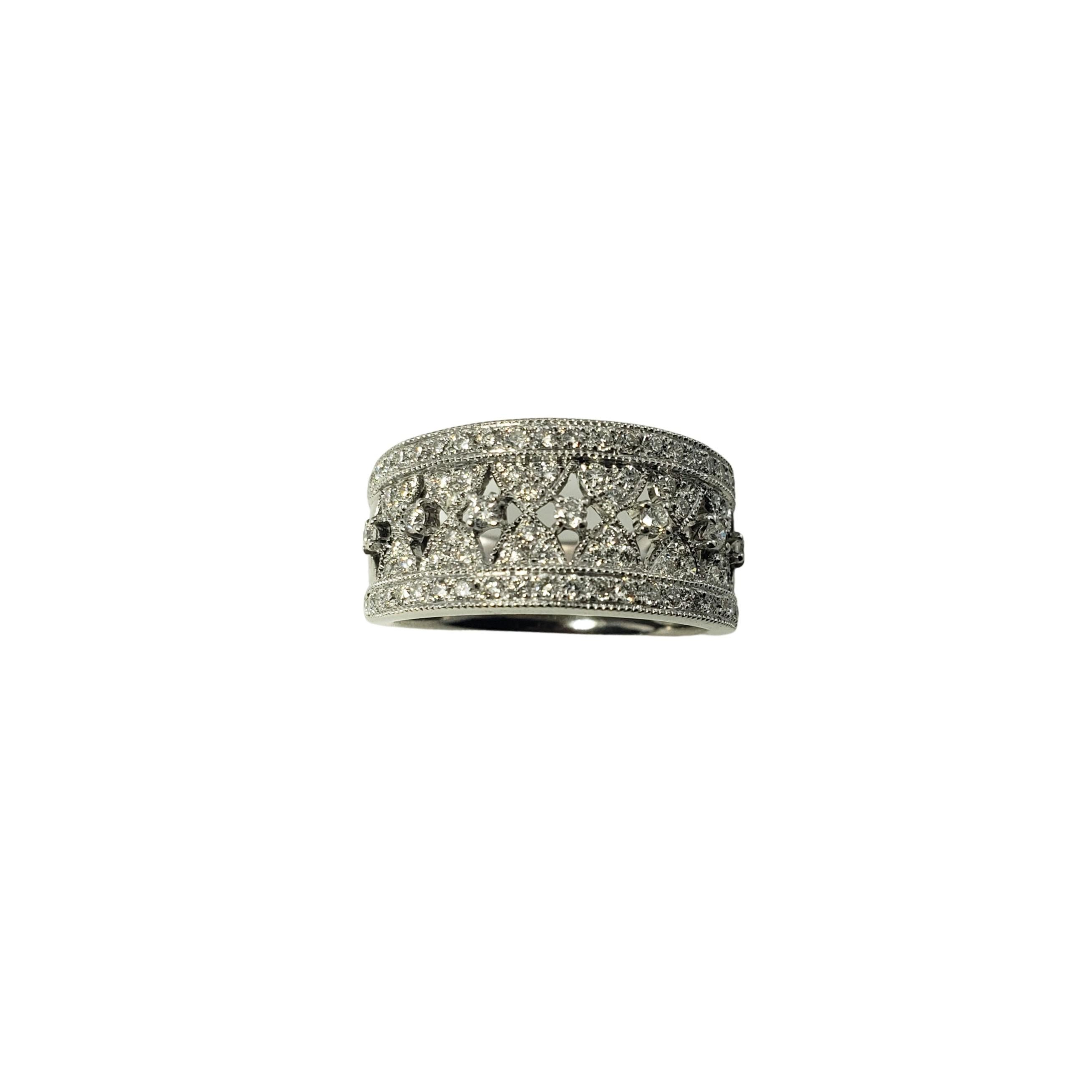 14 Karat White Gold Diamond Band Ring Size 6.5-

This sparkling band features 85 round brilliant cut diamonds set in beautifully detailed 14K white gold.  Width:  9 mm.  Shank:  6 mm.

Approximate total diamond weight:  .70 ct.

Diamond color: 