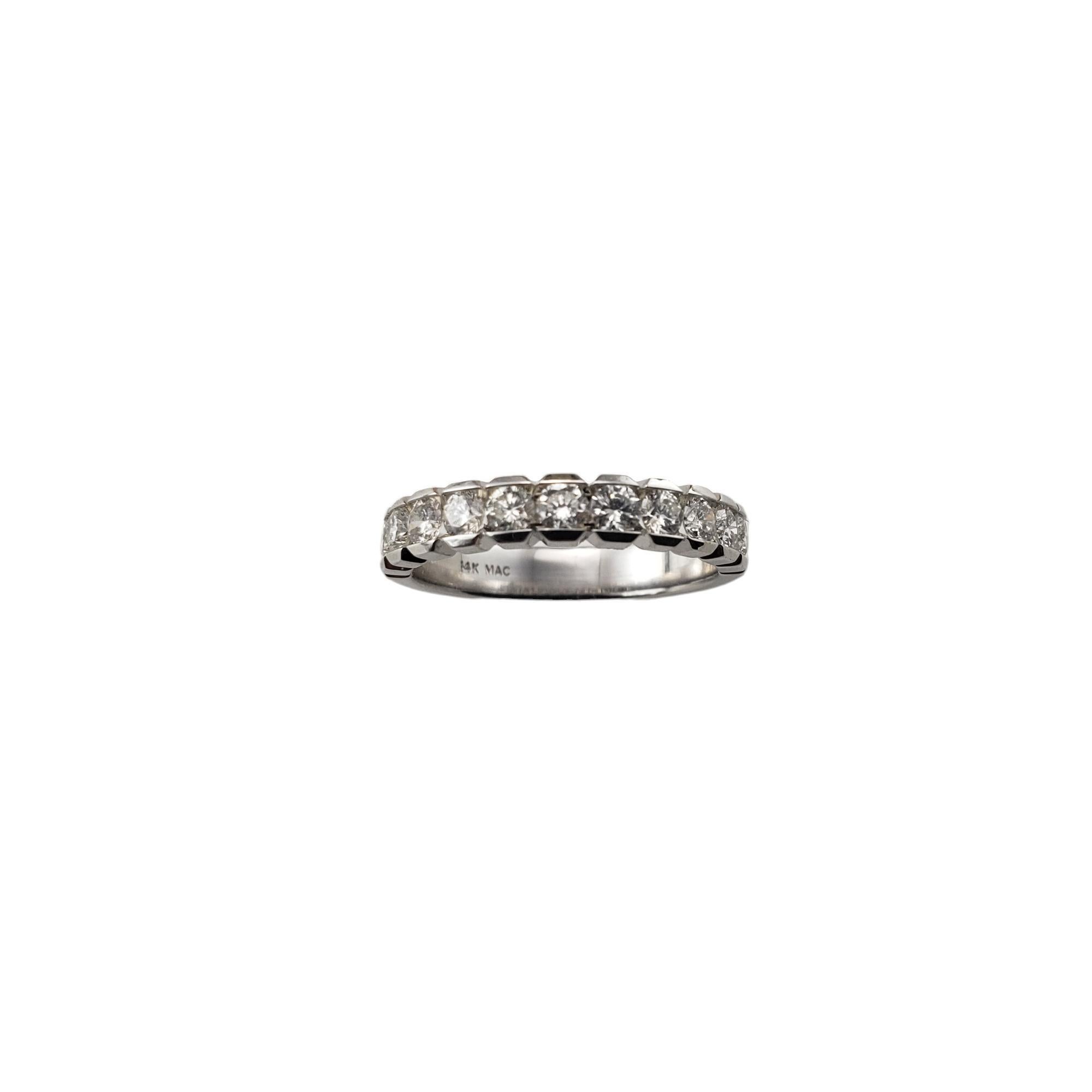 Vintage 14 Karat White Gold and Diamond Band Ring size 7-

This sparkling band features 11 round brilliant cut diamonds set in classic 14K white gold.  Width:  3.8 mm.

Approximate total diamond weight:   .77 ct.

Diamond clarity:  SI1-I1

Diamond