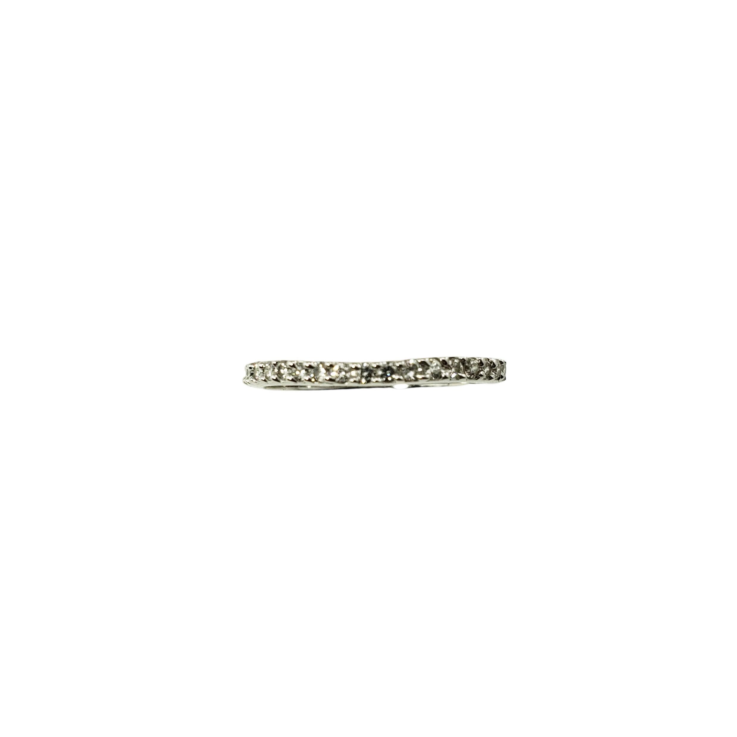 14 Karat White Gold and Diamond Band Ring Size 7-

This elegant 14K white gold band features 18 round brilliant cut diamonds set in a classic curved setting.  Width:  2 mm.  

Approximate total diamond weight:  .18 ct.

Diamond color: J-K

Diamond