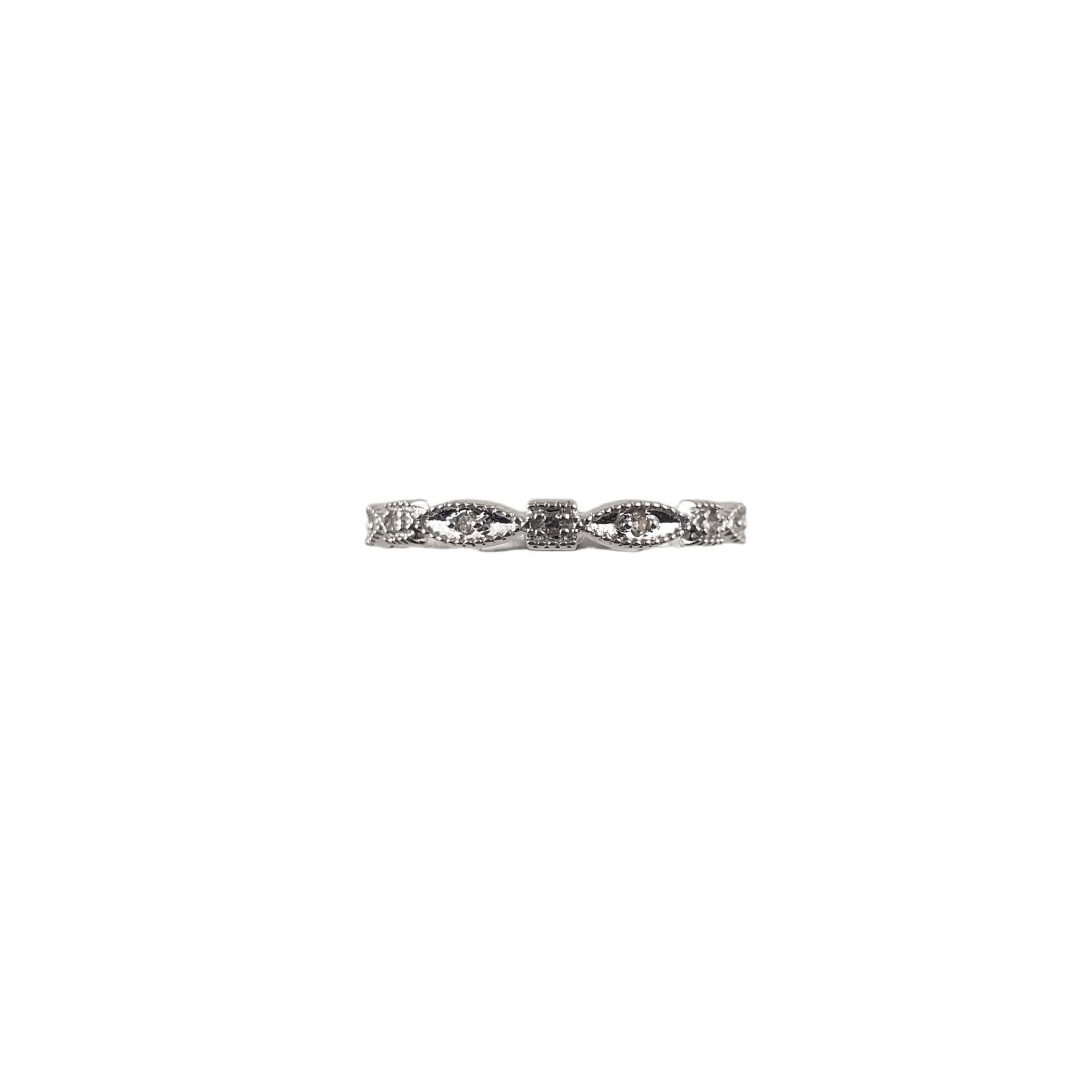 Vintage 14 Karat White Gold and Diamond Band Ring Size 7.25-

This stunning band features seven round single cut diamonds set in beautifully detailed 14K white gold. Width: 2.5 mm.

Approximate total diamond weight: .05 ct.

Diamond clarity: