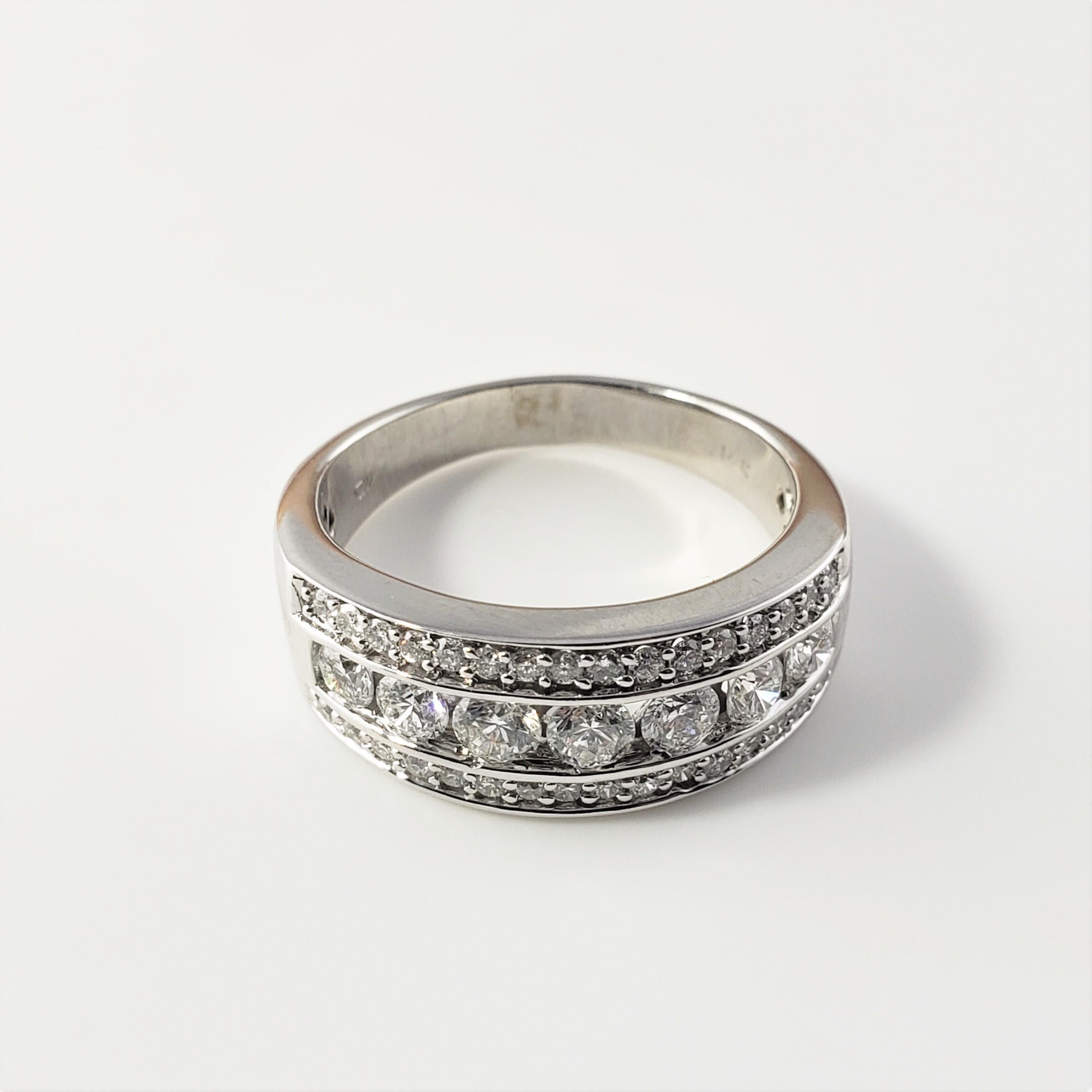14 Karat White Gold and Diamond Band Ring Size 8 -

This sparkling band features 39 round brilliant cut diamonds set in beautifully detailed 14K white gold.  Width:  8 mm.  Shank:  3 mm.

Approximate total diamond weight:  .90 ct.

Diamond color: 